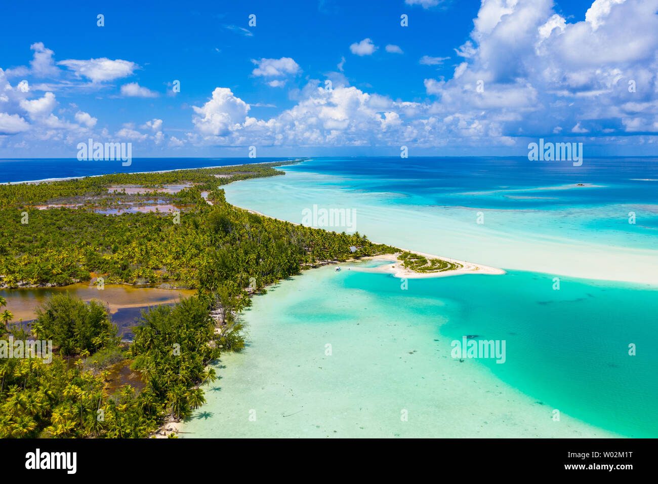 Drone aerial video of Fakarava atoll island motu Blue Lagoon, Teahatea and UNESCO Biosphere Reserve French Polynesia Tahiti, coral reef and Pacific Ocean. Tropical travel paradise in Tuamotus Islands. Stock Photo