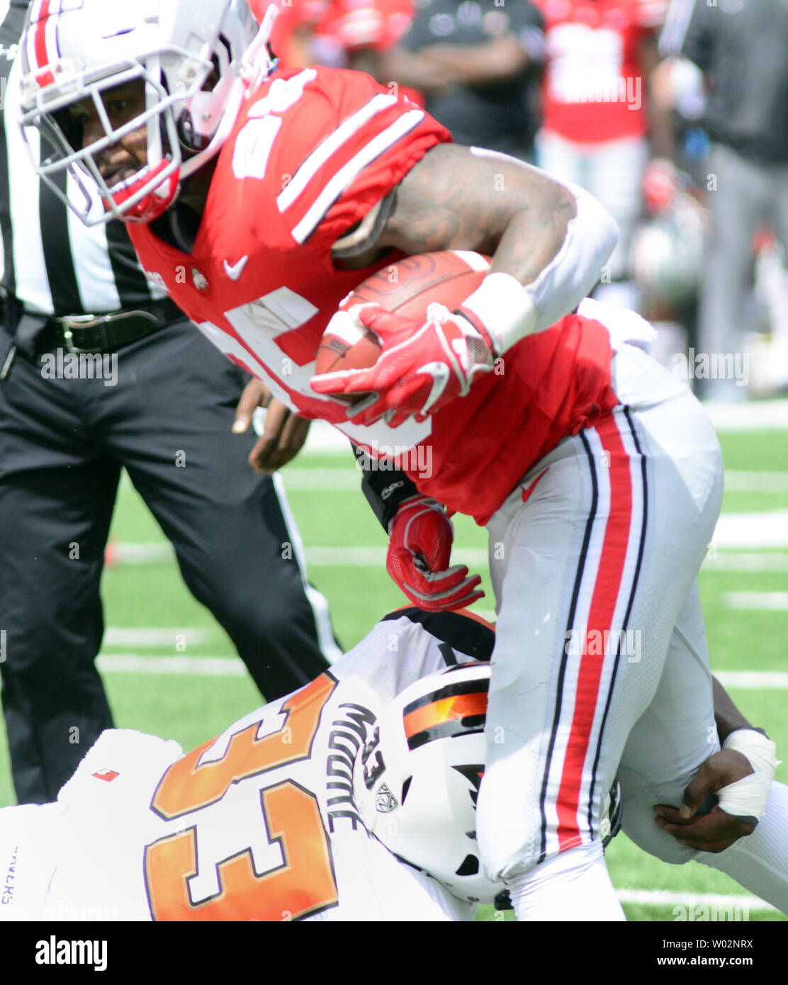 Ohio State Buckeyes running back Mike Weber (25) evades the tackle of Oregon State Beavers safety Jalen Moore (33) and runs 16 yards for a touchdown in the first quarter against Oregon State Beavers at Ohio Stadium in Columbus, Ohio on September1, 2018. Photo by Archie Carpenter/UPI Stock Photo