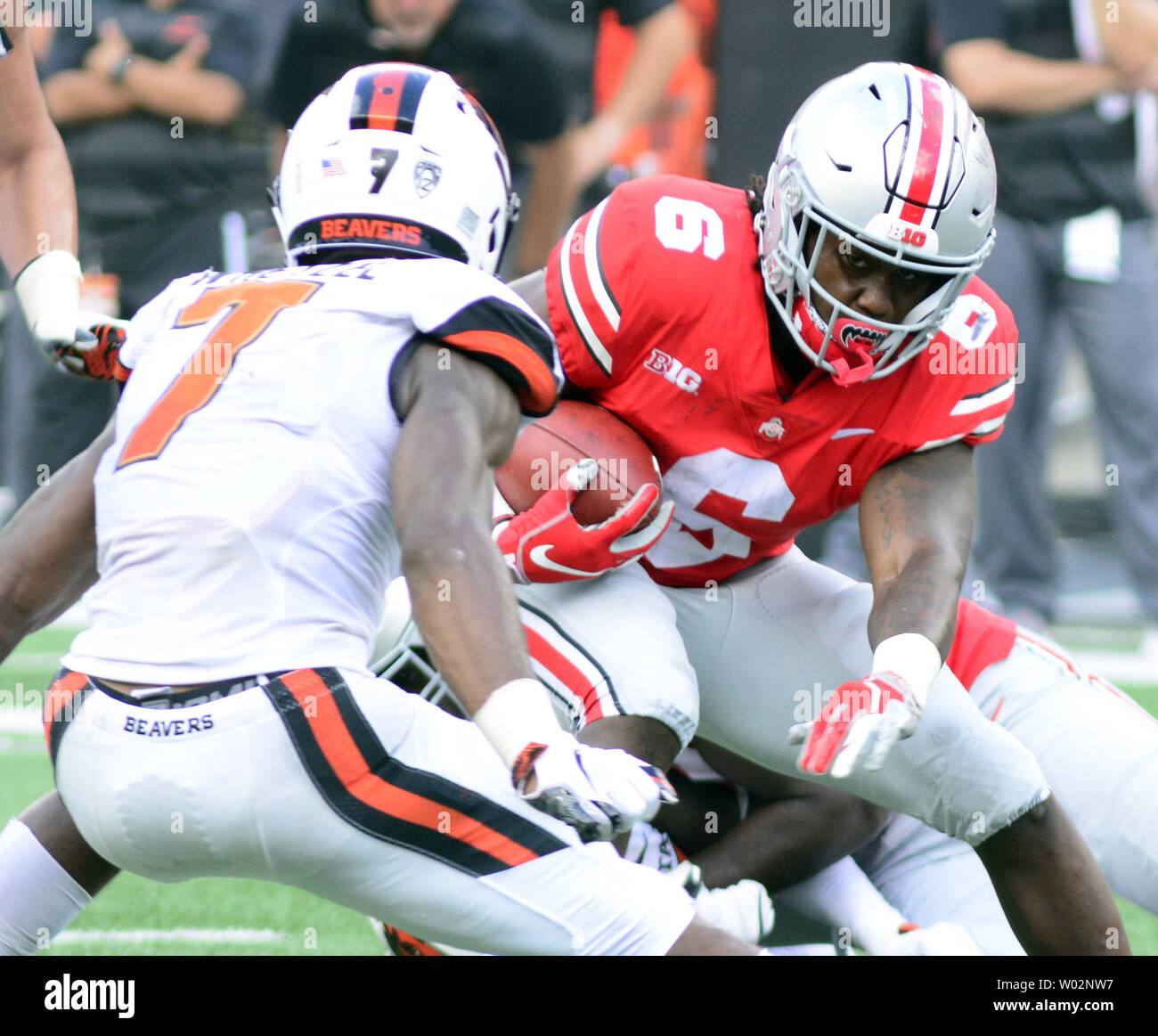 Ohio State Buckeyes quarterback Kory Curtis (6) attempts to dodge  Oregon State Beavers linebacker Kee Whetzel (7) in the fourth quarter  of the Buckeyes 77-31 win against the Oregon State Beavers at Ohio Stadium in Columbus, Ohio on September 1, 2018. Photo by Archie Carpenter/UPI Stock Photo
