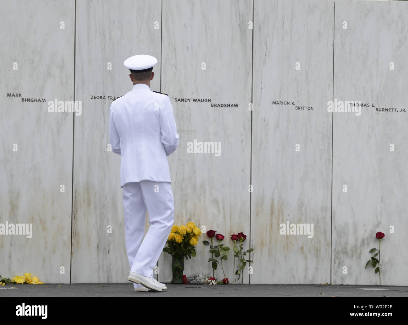 Chaplin Aaron Walling of the USS Somerset walks and pauses at each of the 40 names on the Wall of Names at the Flight 93 National Memorial near Shanksville, Pennsylvania on September 11, 2018.  Photo by Archie Carpenter/UPI Stock Photo