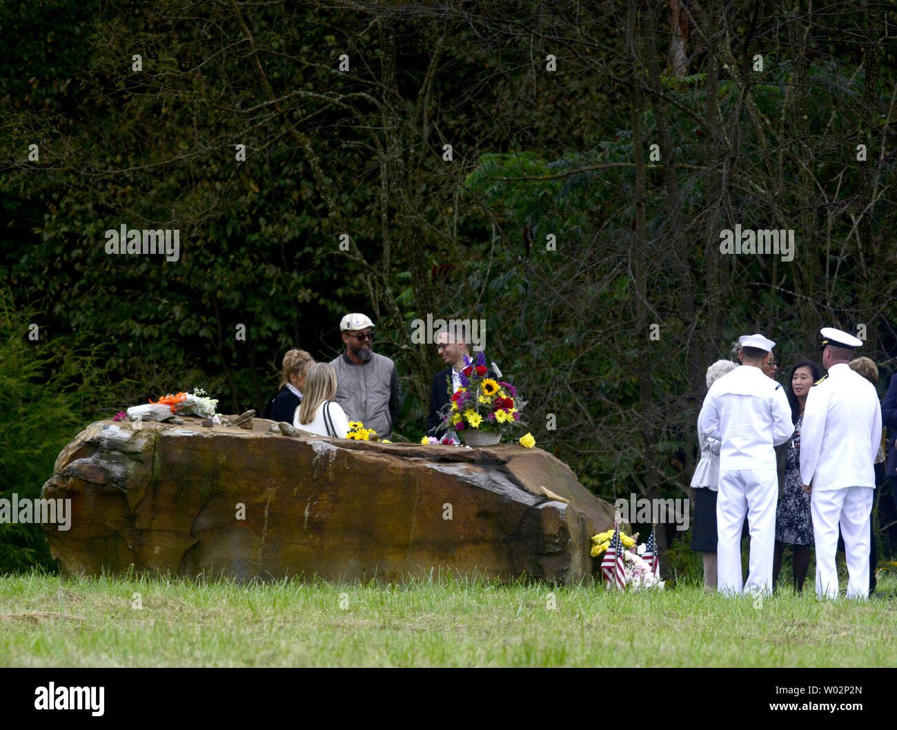 Family members and select guest visits the boulder that marks the crash site of  Flight 93 at the Flight 93 National Memorial near Shanksville, Pennsylvania on September 11, 2018.  Photo by Archie Carpenter/UPI Stock Photo