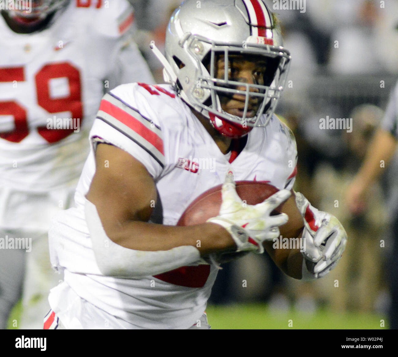 Ohio State Buckeyes running back J.K. Dobbins (2) pulls in a short pass and scores a 26 yard touchdown in the second quarter against the Penn State Nittany Lions at Beaver Stadium in State College , Pennsylvania on September 29, 2018. Photo by Archie Carpenter/UPI Stock Photo