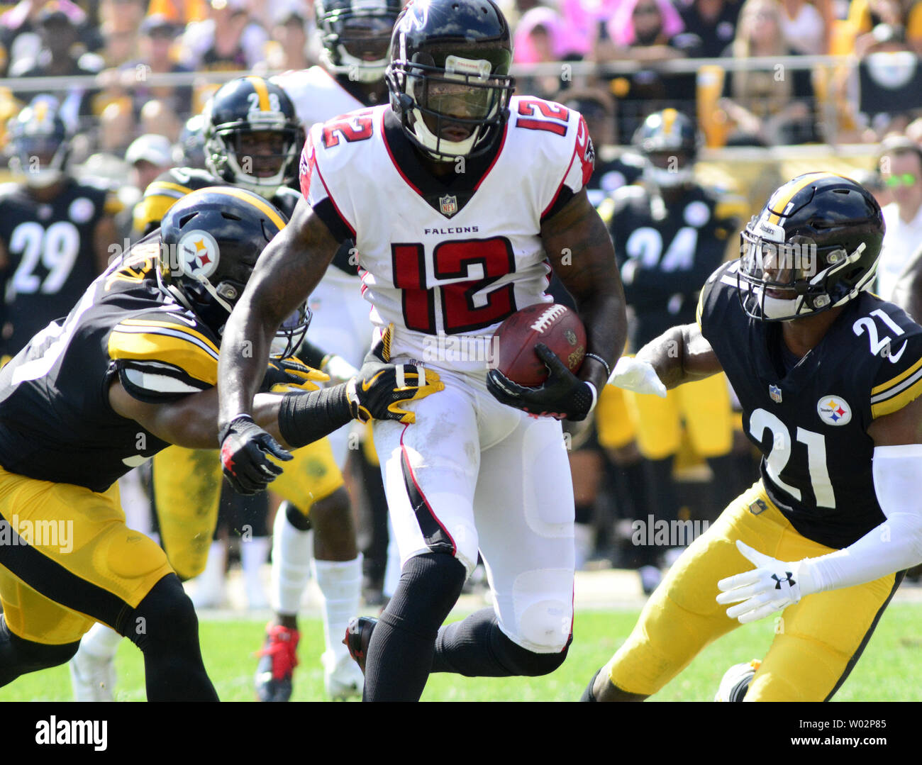 Atlanta Falcons wide receiver Mohamed Sanu (12) makes the catch and evades Pittsburgh Steelers free safety Sean Davis (21) and Pittsburgh Steelers linebacker Jon Bostic (51) and runs 43yards for a touchdown in the second quarter at Heinz Field in Pittsburgh on October 7, 2018. Photo by Archie Carpenter/UPI Stock Photo
