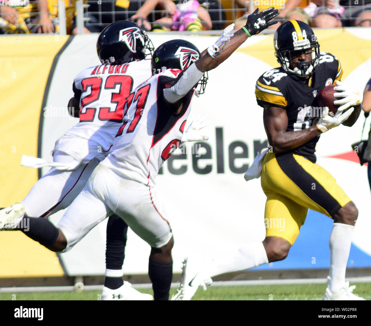 Pittsburgh Steelers wide receiver Antonio Brown (84) pulls in a 47 yard reception for a touchdown with Atlanta Falcons cornerback Robert Alford (23) and Atlanta Falcons strong safety Damontae Kazee (27) in coverage in the fourth quarter of the Steelers 41-17 win against the Atlanta Falcons at Heinz Field in Pittsburgh on October 7, 2018. Photo by Archie Carpenter/UPI Stock Photo