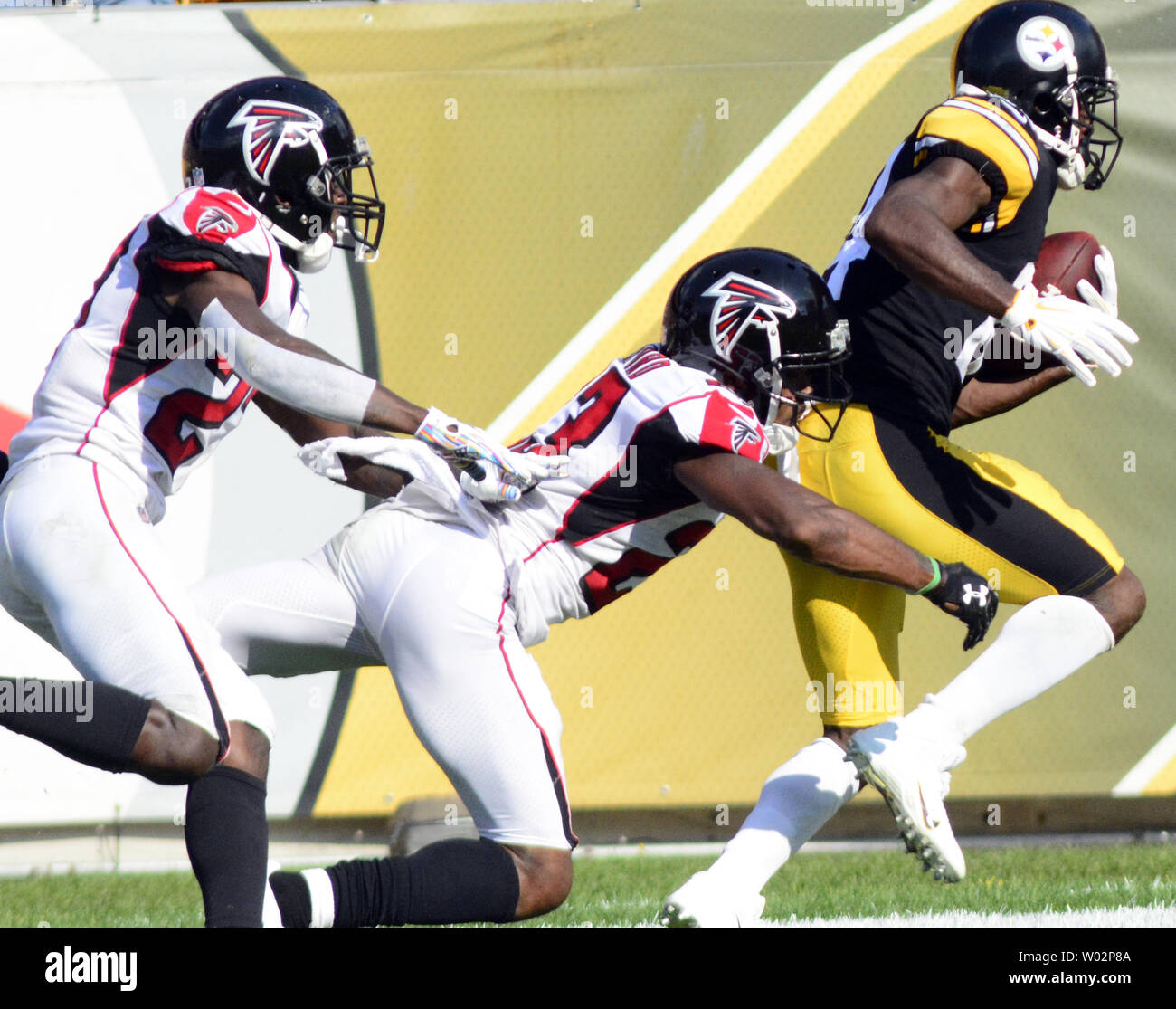 Pittsburgh Steelers wide receiver Antonio Brown (84) pulls in a 47 yard reception for a touchdown with Atlanta Falcons cornerback Robert Alford (23) and Atlanta Falcons strong safety Damontae Kazee (27) in coverage in the fourth quarter of the Steelers 41-17 win against the Atlanta Falcons at Heinz Field in Pittsburgh on October 7, 2018. Photo by Archie Carpenter/UPI Stock Photo