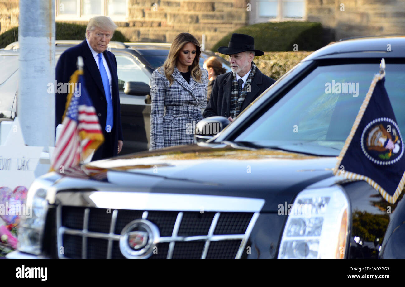 Rabbi Jeffrey Myers escorts President Donald Trump with First Lady Melania Trump as they place stones and flowers at each of the Stars of David  erected for the 11 victims of the mass shooting on Saturday morning at the Tree of Life Synagogue in the Squirrel Hill neighborhood of Pittsburgh on October 30, 2018.  Photo by Archie Carpenter/UPI Stock Photo