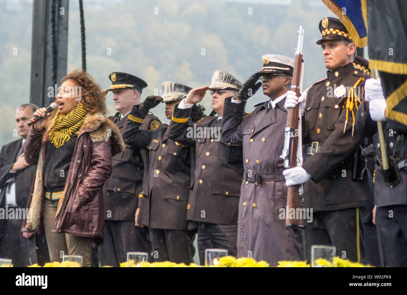 Actress Tamara Tunie sings the National Anthem at the Rally for Peace in Point State Park in Pittsburgh on November 9, 2018. The rally was held to remember the 11 people that lost their lives at the Tree of Life Synagogue shooting.   Photo by Archie Carpenter/UPI Stock Photo