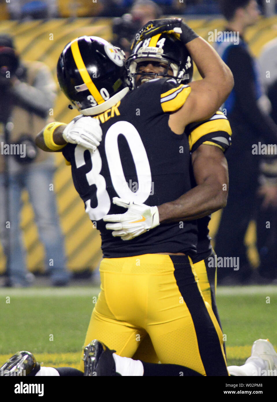 Pittsburgh Steelers running back James Conner (30) celebrates his touchdown with Pittsburgh Steelers wide receiver Antonio Brown (84) in the first quarter against the Los Angeles Chargers at Heinz Field in Pittsburgh on December 2, 2018.  Photo by Archie Carpenter/UPI Stock Photo