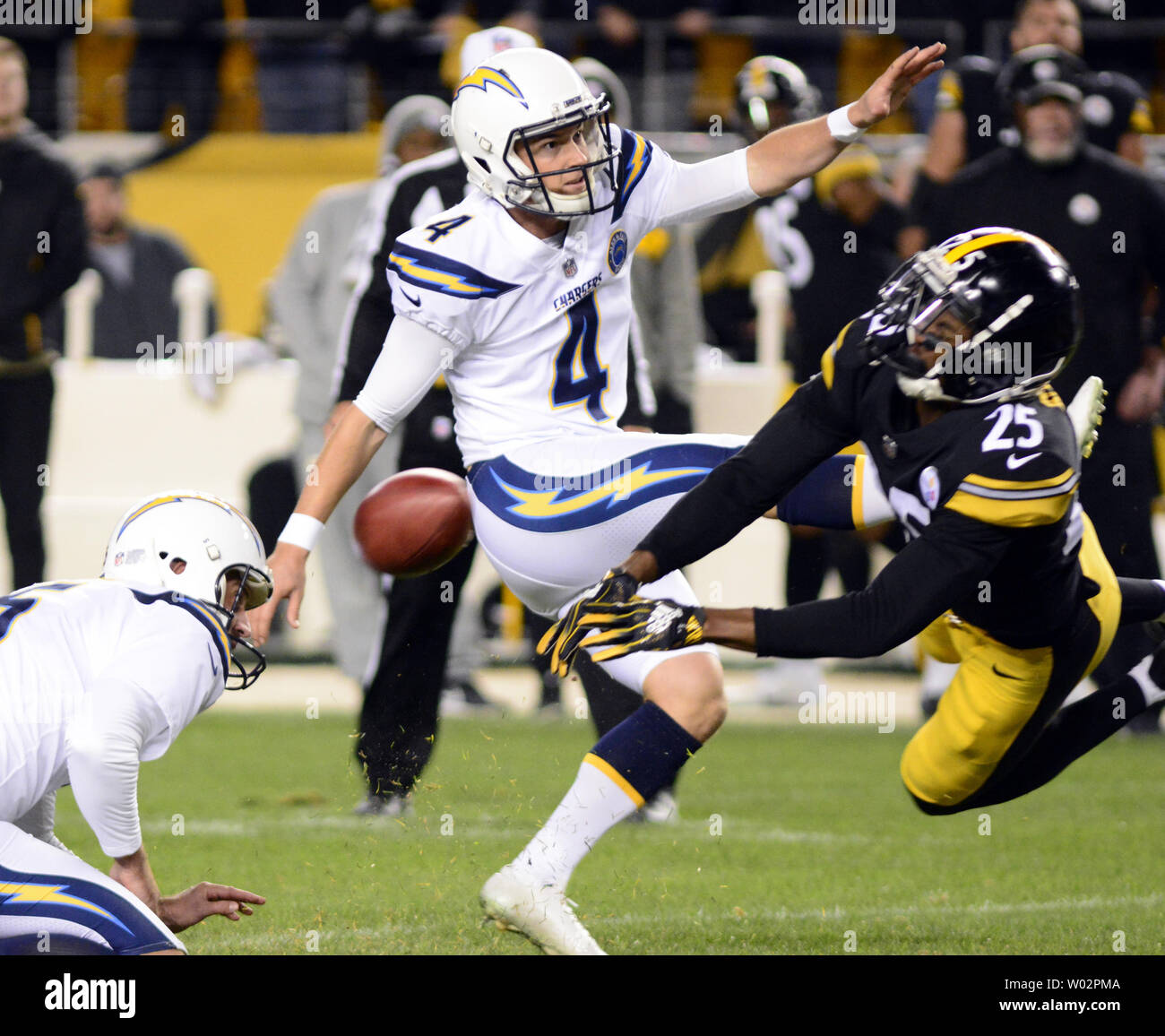 Pittsburgh Steelers cornerback Artie Burns (25) blocks the second field goal attempt of Los Angeles Chargers kicker Mike Badgley (4) but a Pittsburgh Steelers penalty allows for a third try and the Chargers win 33-30 at Heinz Field in Pittsburgh on December 2, 2018.  Photo by Archie Carpenter/UPI Stock Photo