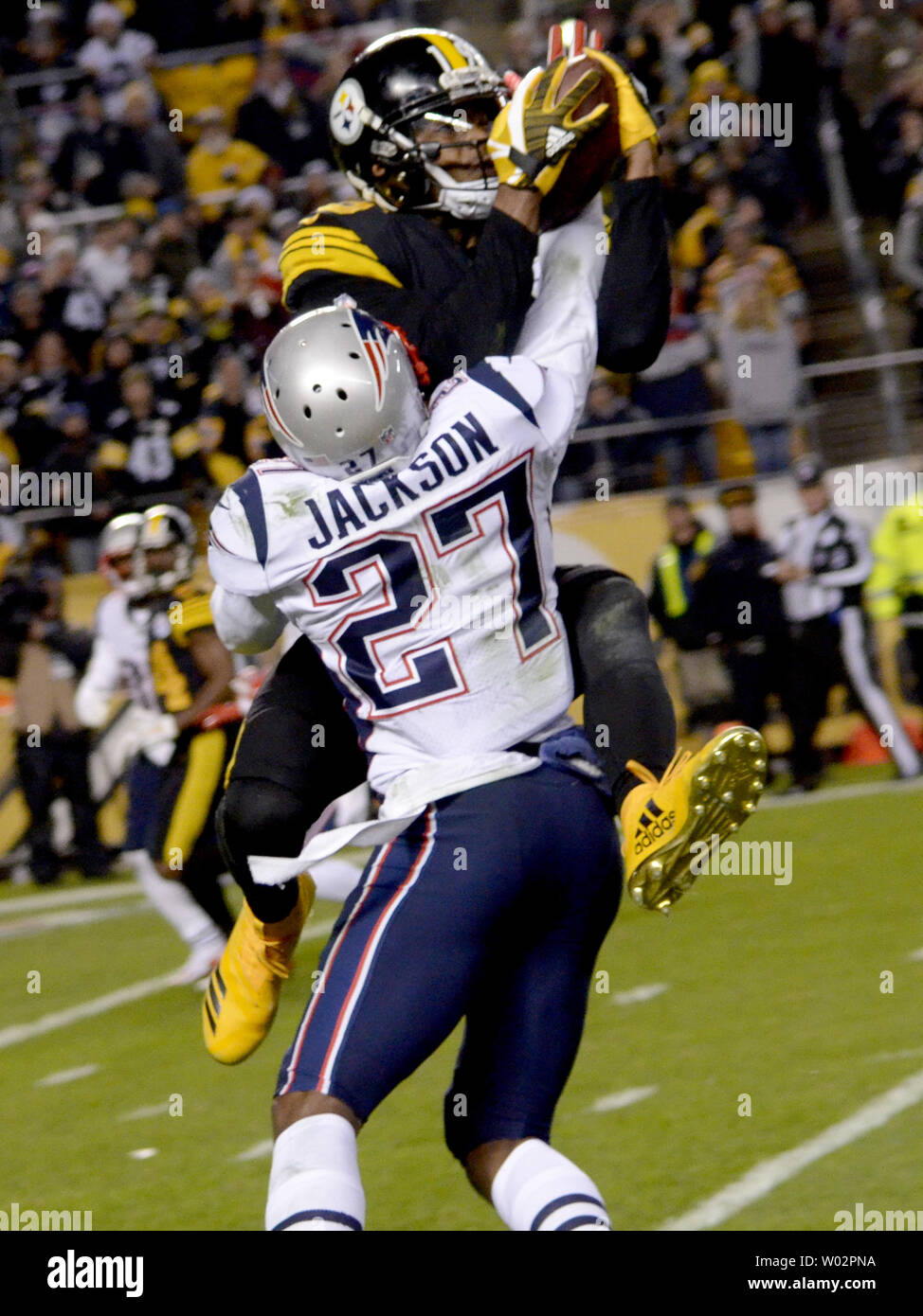 New England Patriots defensive back J.C. Jackson (27) breaks up the pass intended for Pittsburgh Steelers wide receiver JuJu Smith-Schuster (19) in the fourth quarter of the Steelers 17-10 win at Heinz Field in Pittsburgh on December 16, 2018.  Photo by Archie Carpenter/UPI Stock Photo