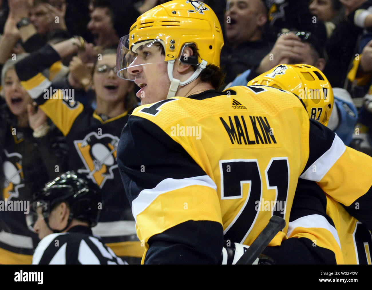 Pittsburgh Penguins center Sidney Crosby (87) celebrates his goal with Pittsburgh Penguins center Evgeni Malkin (71) during the second period of the Pens 5-3 win at PPG Paints Arena in Pittsburgh on March 12, 2018.   Photo by Archie Carpenter/UPI Stock Photo