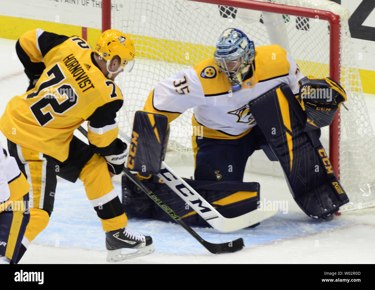 Nashville Predators goaltender Pekka Rinne (35) blocks the shot of Pittsburgh Penguins right wing Patric Hornqvist (72) during the first period of the Predators 3-1 win at PPG Paints Arena in Pittsburgh on March 29, 2018.   Photo by Archie Carpenter/UPI Stock Photo