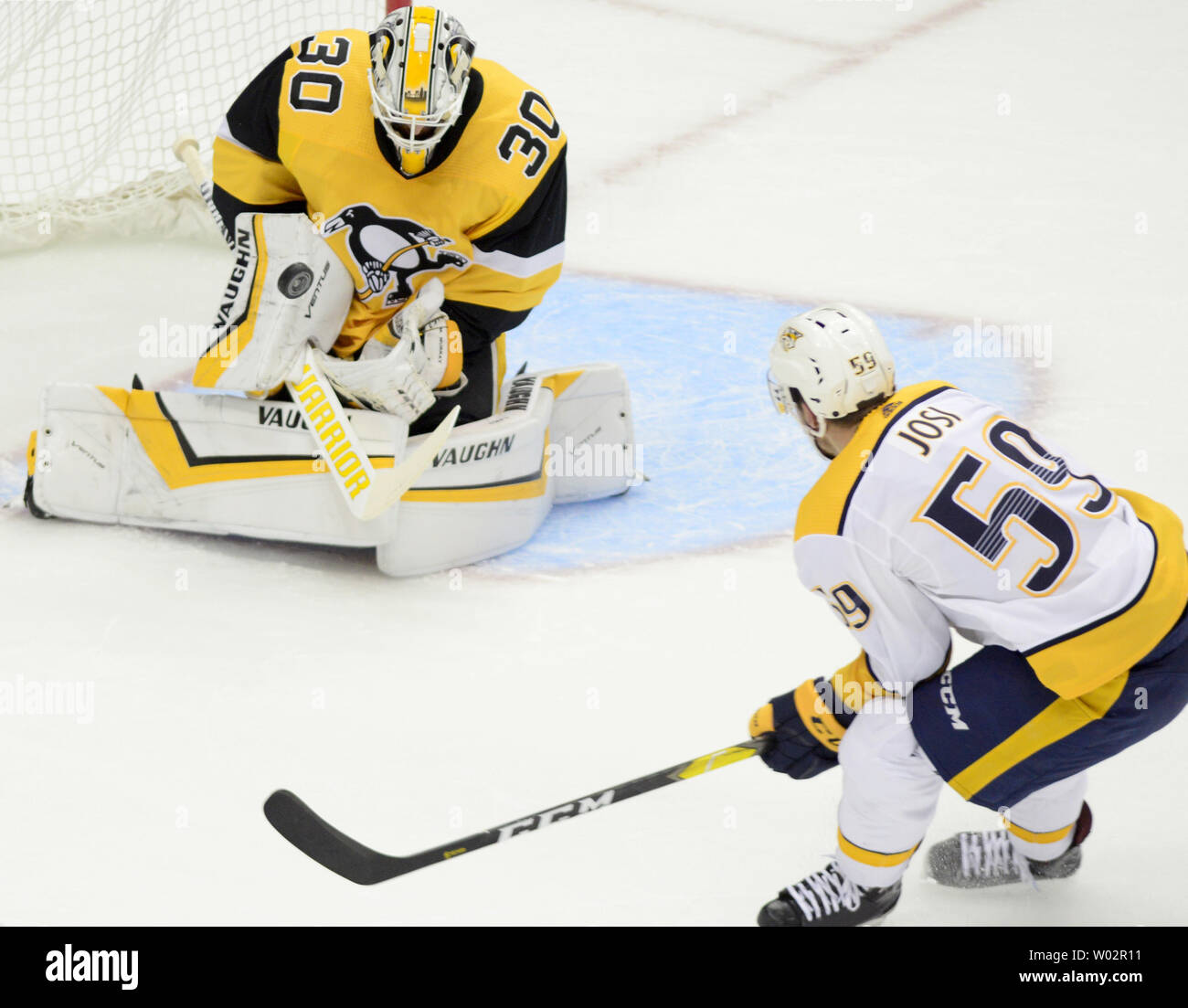 Pittsburgh Penguins goaltender Matt Murray (30) blocks the shot of Nashville Predators defenseman Roman Josi (59) in the third period of the Predators 3-1 win against the Pittsburgh Penguins at PPG Paints Arena in Pittsburgh on March 29, 2018.   Photo by Archie Carpenter/UPI Stock Photo