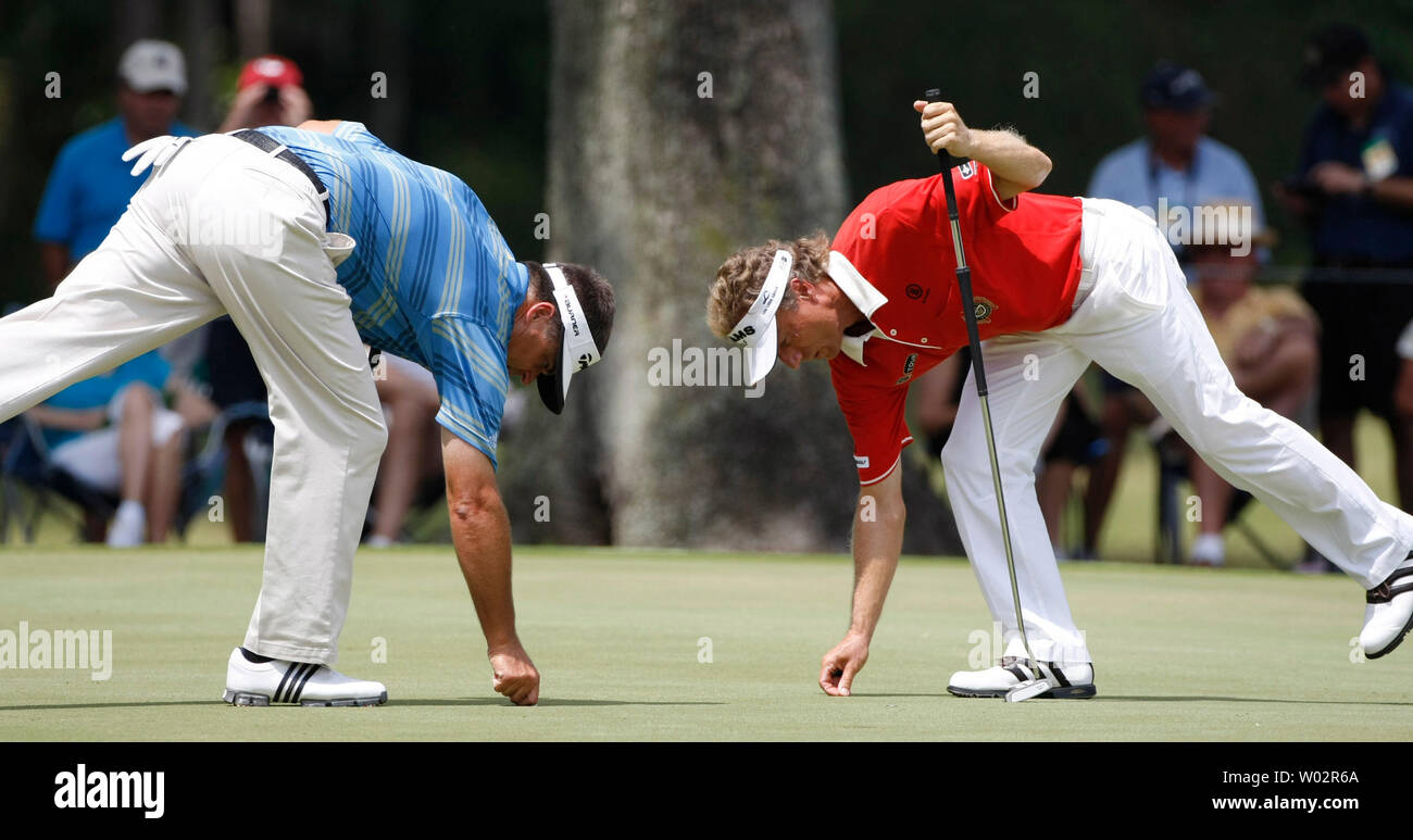 Co-leaders Bernhard Langer (R), from Munich, Germany, and Kenny Perry (L), from Franklin, Kentucky, clean up the #1 green prior to their putts during the third round of The Players Championship PGA golf tournament in Ponte Vedra Beach, Florida on May 10, 2008 .   (UPI Photo/Mark Wallheiser) Stock Photo