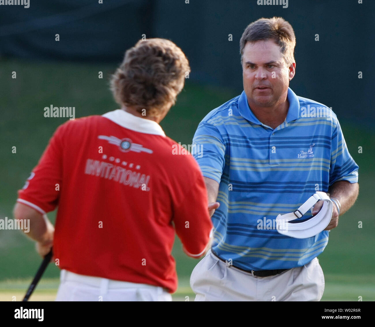 Kenny Perry (R), from Franklin, Kentucky, congratulates Bernhard Langer (L), from Munich, Germany, on green #18 after their third round of The Players Championship PGA golf tournament in Ponte Vedra Beach, Florida on May 10, 2008.   (UPI Photo/Mark Wallheiser) Stock Photo