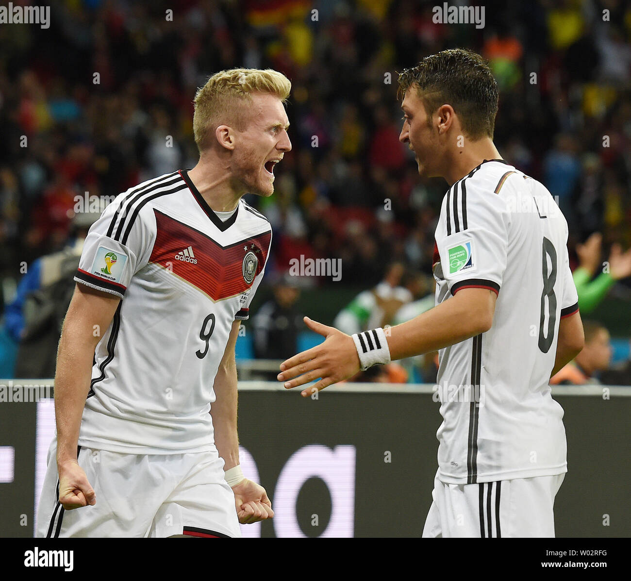 Andre Schurrle (L) of Germany celebrates scoring the opening goal with team-mate Mesut Ozil during the 2014 FIFA World Cup Round of 16 match at the Estadio Beira-Rio in Porto Alegre, Brazil on June 30, 2014. UPI/Chris Brunskill Stock Photo