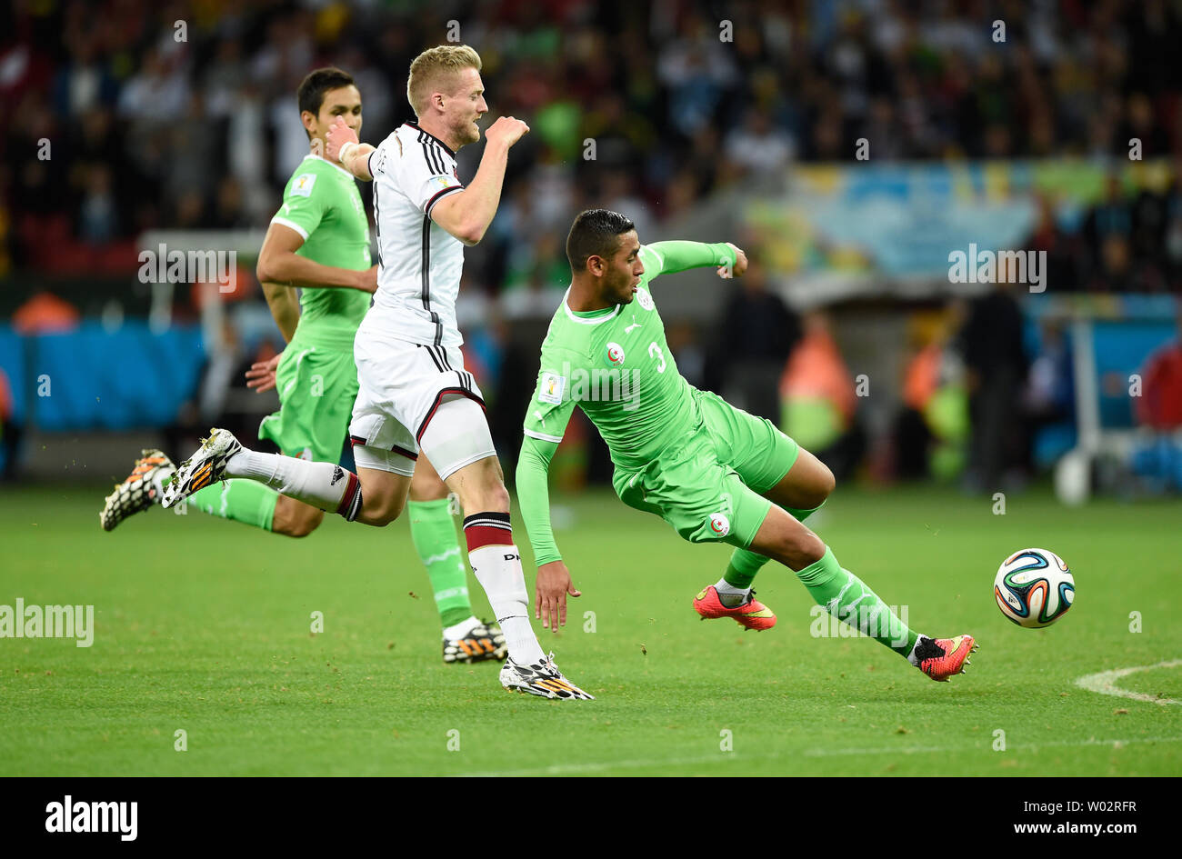 Andre Schurrle (L) of Germany competes with Faouzi Ghoulam of Algeria during the 2014 FIFA World Cup Round of 16 match at the Estadio Beira-Rio in Porto Alegre, Brazil on June 30, 2014. UPI/Chris Brunskill Stock Photo