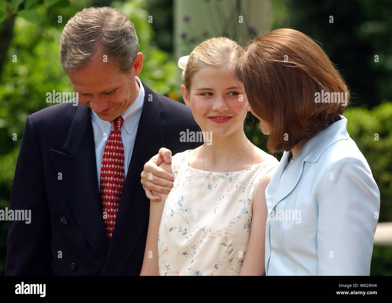 Edward, Elizabeth and Lois Smart, left to right, attend a ceremony in