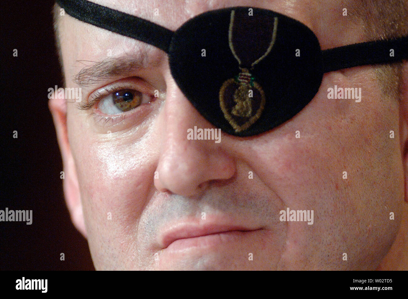 Army Staff Sgt. John Daniel Shannon, who lost his eye in combat operations in Iraq and received treatment at the Walter Reed Army Medical Center, testifies to a House Oversight and Government Reform Committee Hearing on the care and conditions of wounded soldiers at Walter Reed Army Medical Center, in Washington on March 5, 2007. (UPI Photo/Kevin Dietsch) Stock Photo