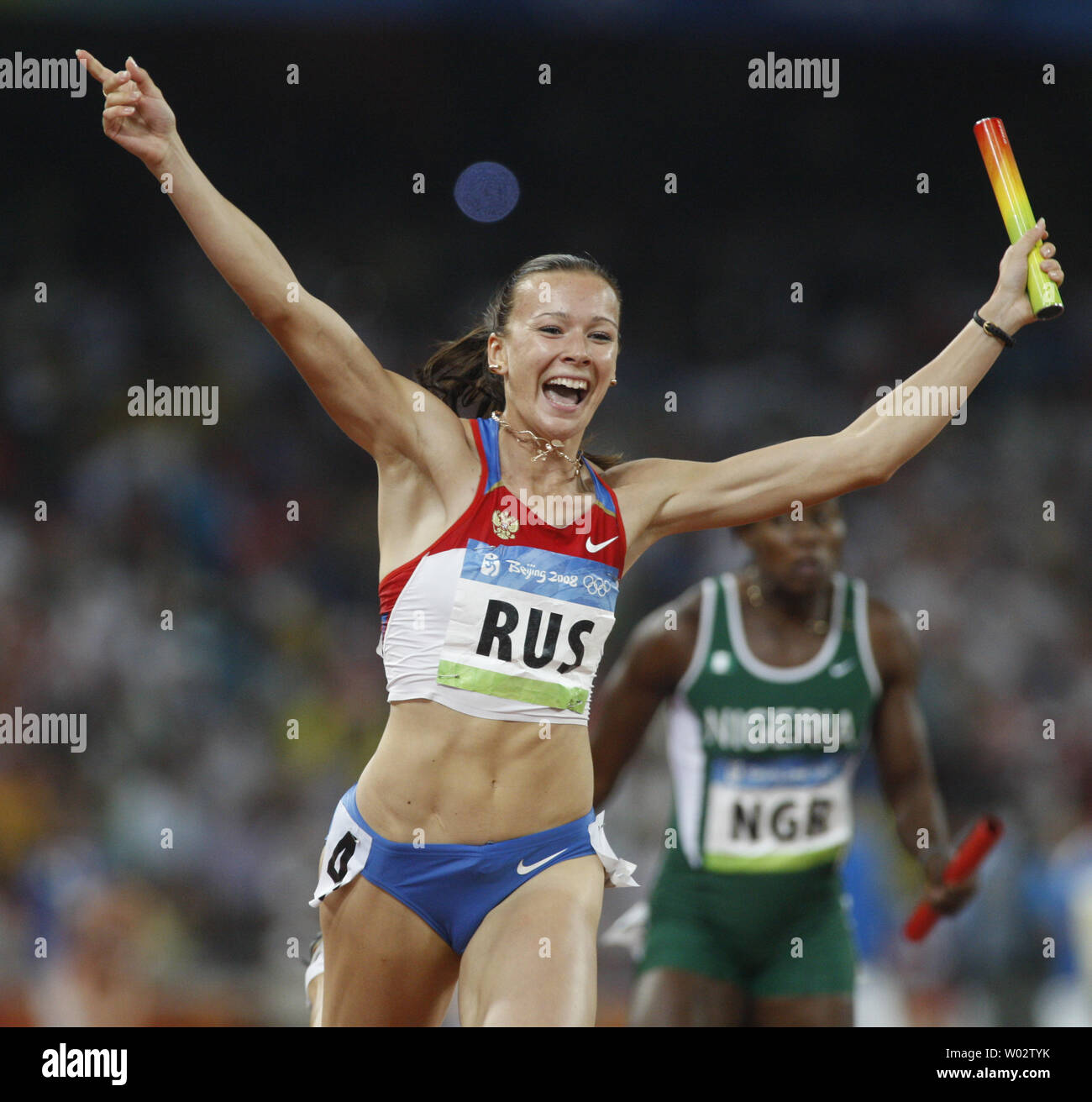 Yuliya Chermoshanskaya of Russia celebrates winning the women's 4x100m relay at the 2008 Summer Olympics in the National Stadium in Beijing on August 22, 2008. Russia won gold with a time of 42.31.    (UPI Photo/Terry Schmitt) Stock Photo