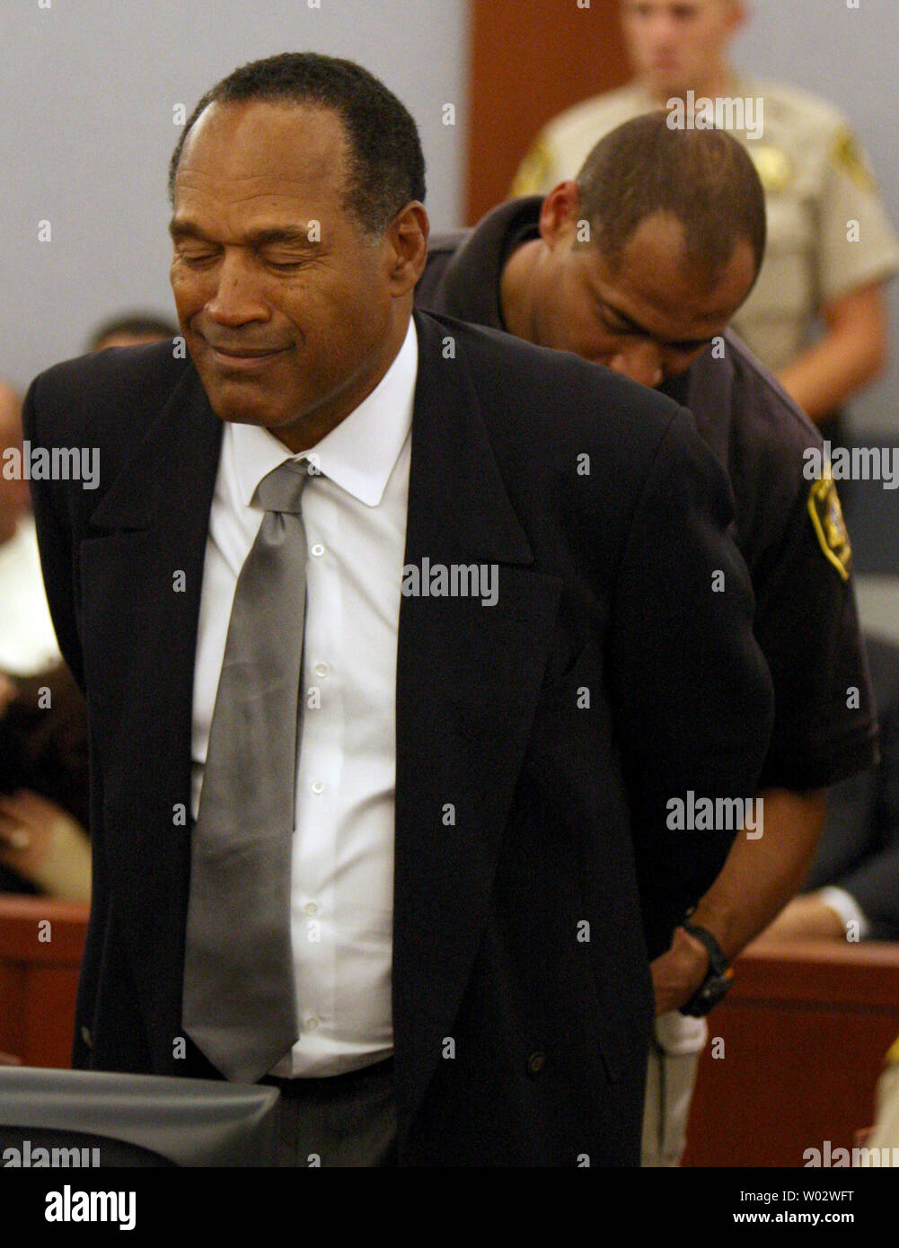 O.J. Simpson is taken into custody after being found guilty on all 12 charges, including felony kidnapping, armed robbery and conspiracy at the Clark County Regional Justice Center in Las Vegas, Nevada on October 3, 2008. The verdict comes 13 years to the day after Simpson was acquitted of murdering his ex-wife Nicole Brown Simpson and Ron Goldman. (UPI Photo/Daniel Gluskoter) Stock Photo