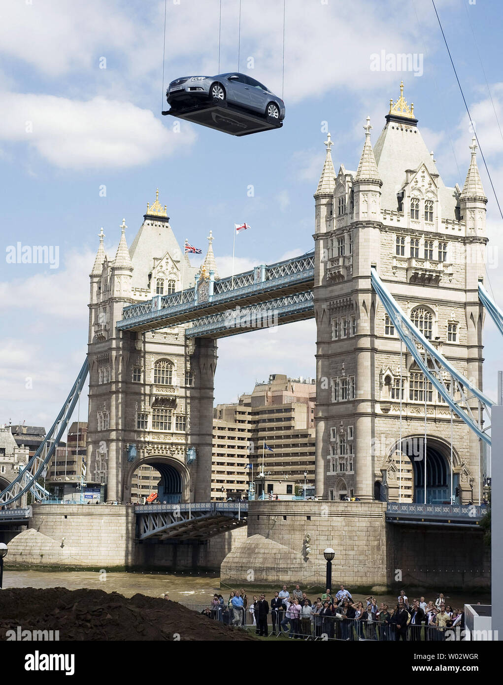 Ouderling samen Of anders The new Opel/Vauxhall Insignia drops twelve stories from a crane above  Tower Bridge at Potters Field in London, England during its world debut,  July 21, 2008. The Insignia will be available in
