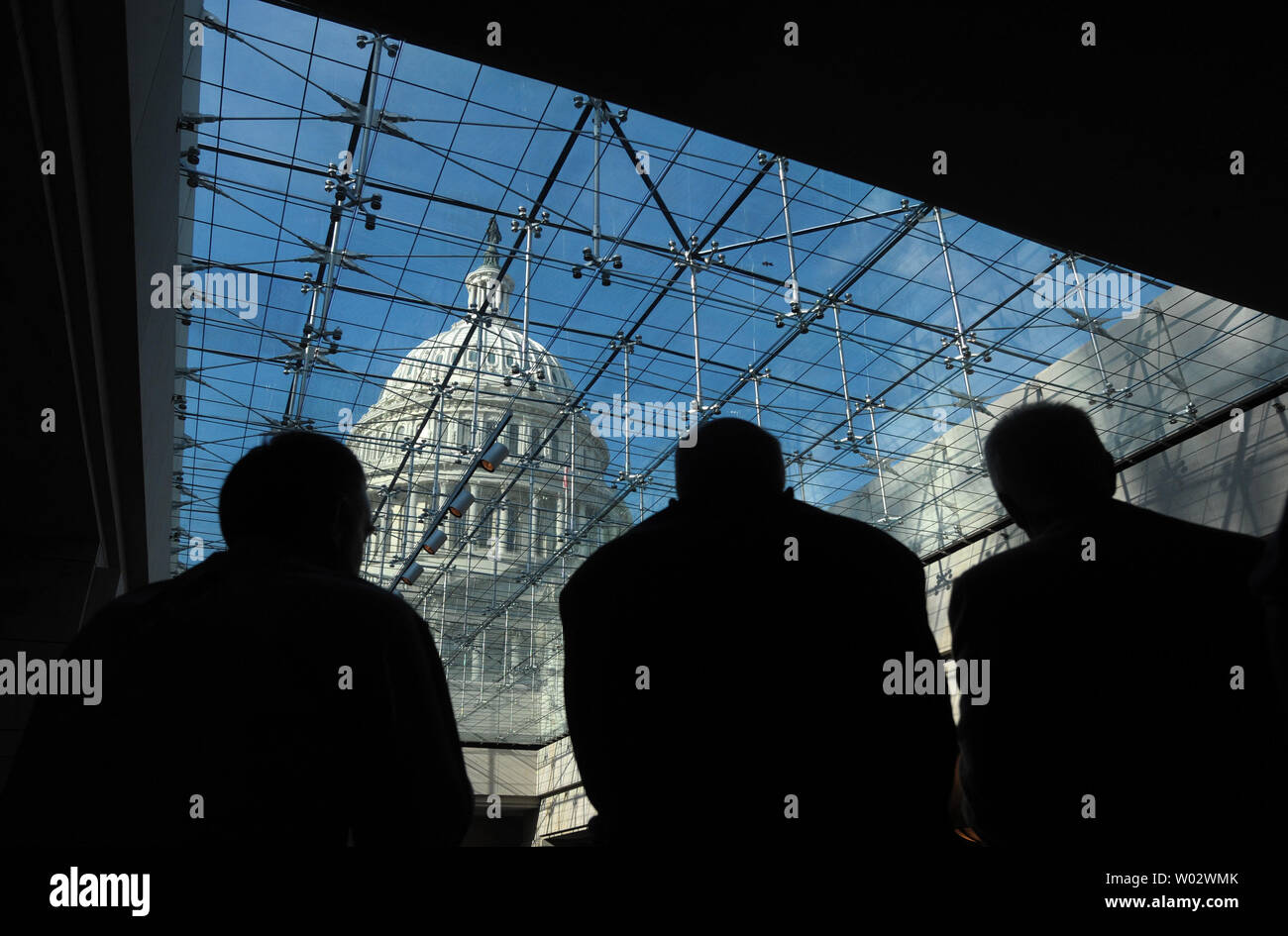 A View Of The Capitol Dome Is Seen Through A Glass Ceiling