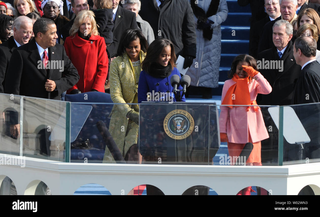 President Barack Obama (L) smiles at his daughters Malia and Sasha and his wife Michelle as they head to the podium for Obama to be sworn-in as the 44th President of the United States on the west steps of the Capitol on January 20, 2009.  UPI/Pat Benic Stock Photo