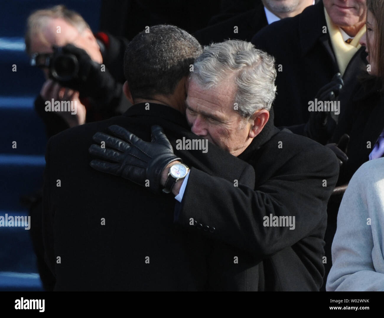 President Barack Obama (L) is hugged by former President George W. Bush after Obama was sworn-in as the 44th President of the United States on the west steps of the Capitol on January 20, 2009.  UPI/Pat Benic Stock Photo