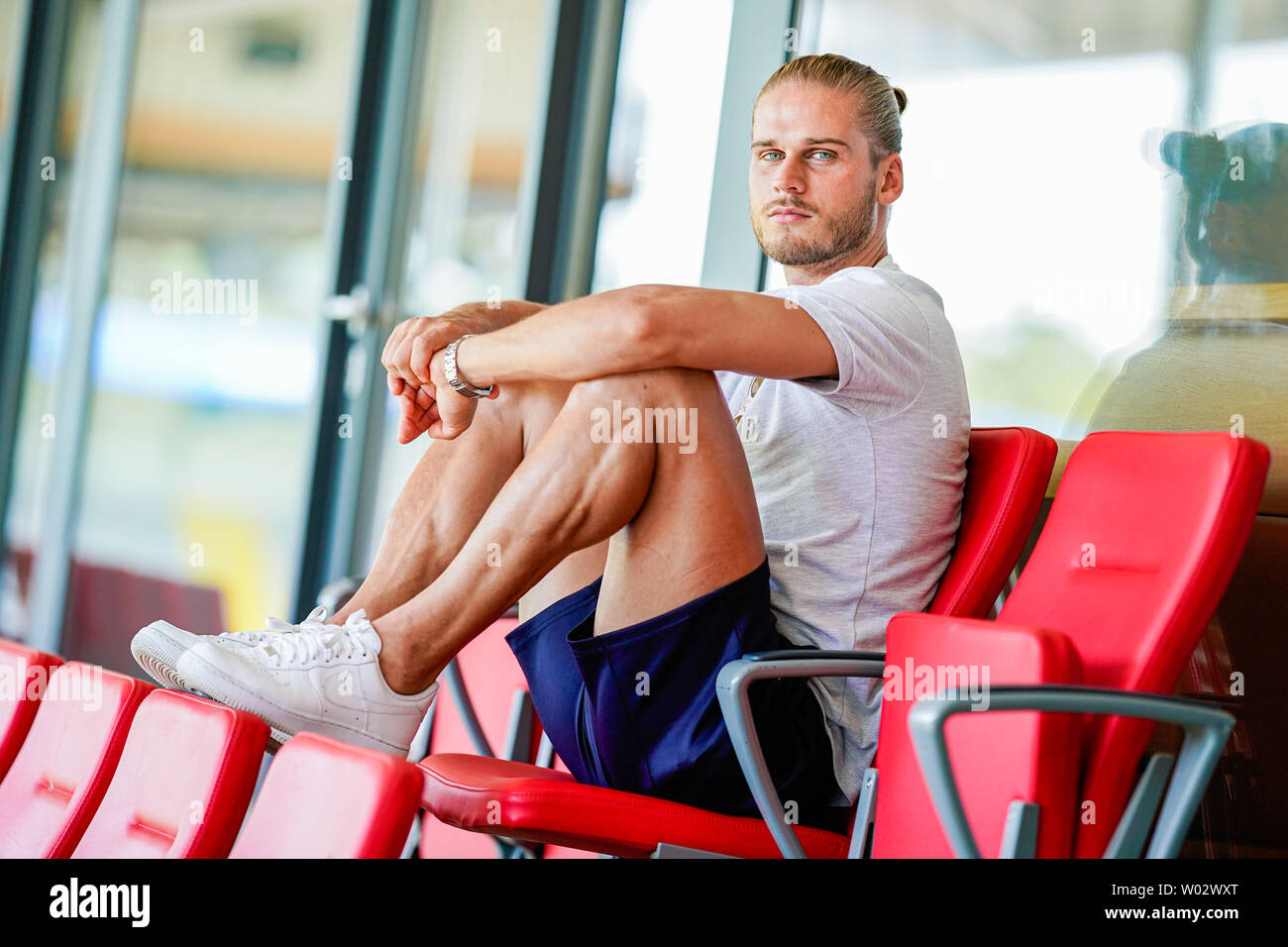 Sandhausen, Germany. 25th June, 2019. Rurik Gislason, player of the second division football team SV Sandhausen, is sitting on the stadium grandstand during a conversation. Gislason from SV Sandhausen became world famous a year ago. Not because he delivered sensational performances for Iceland at the World Cup in Russia, but because of his appearance. (to dpa 'One year after the hype: The new life of the 'beautiful' Rurik Gislason') Credit: Uwe Anspach/dpa/Alamy Live News Stock Photo