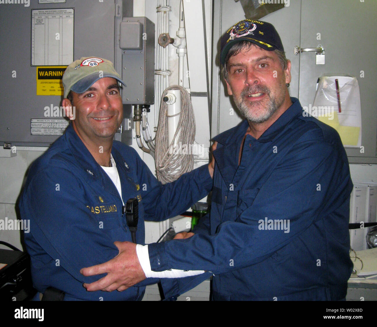 Maersk-Alabama cargo ship captain Richard Phillips (R), stands alongside Cmdr. Frank Castellano, the commanding officer of USS Bainbridge, after U.S. Navy forces rescued Phillips from pirate captivity, off the coast of Somalia, April 12, 2009. Captain Phillips was rescued following a firefight that killed three of the four Somali pirates who had been holding him for four days in a lifeboat off the coast of Africa. UPI/U.S. Navy Stock Photo