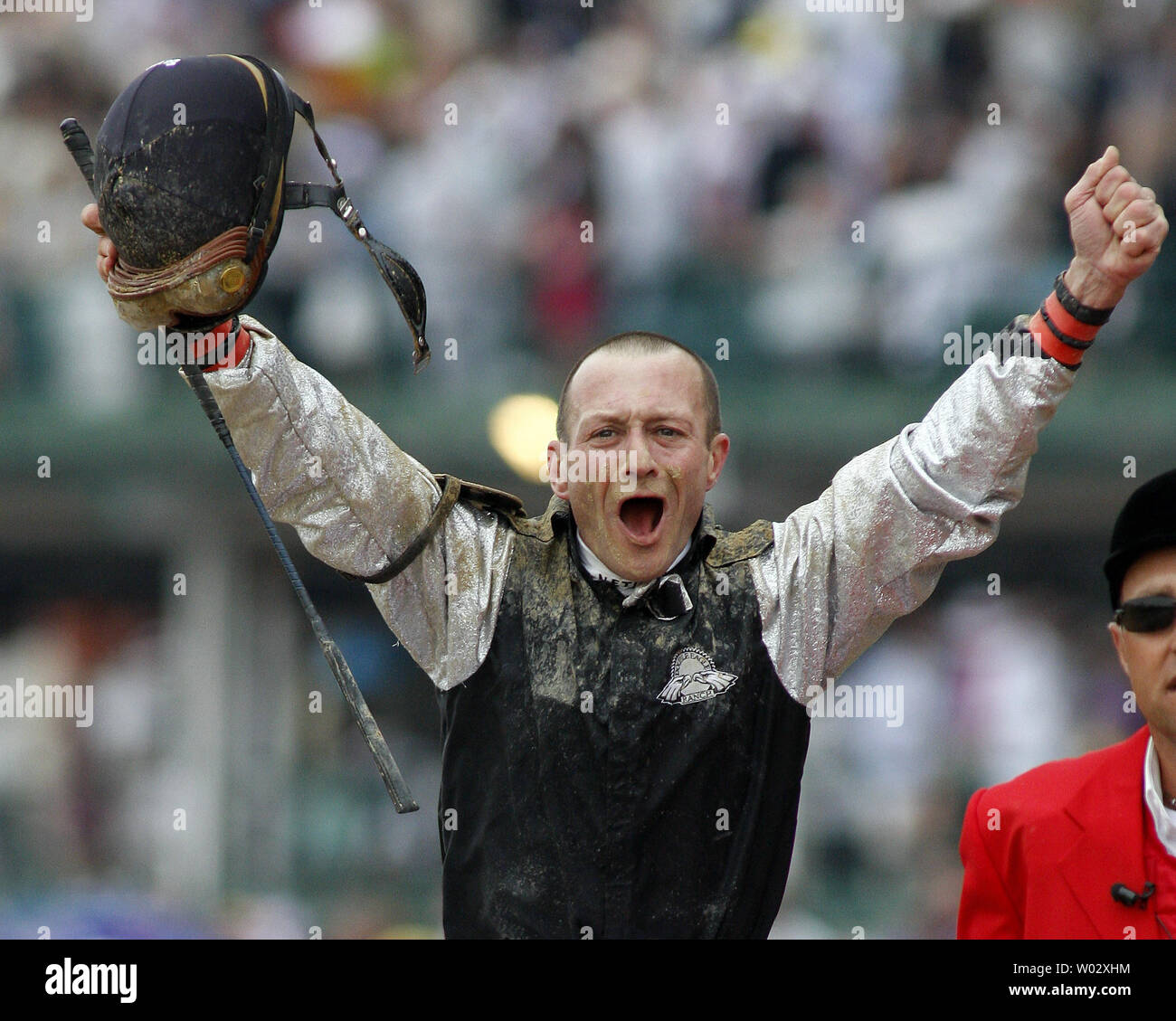 Calvin Borel, aboard Mine that Bird, celebrates winning the 135th