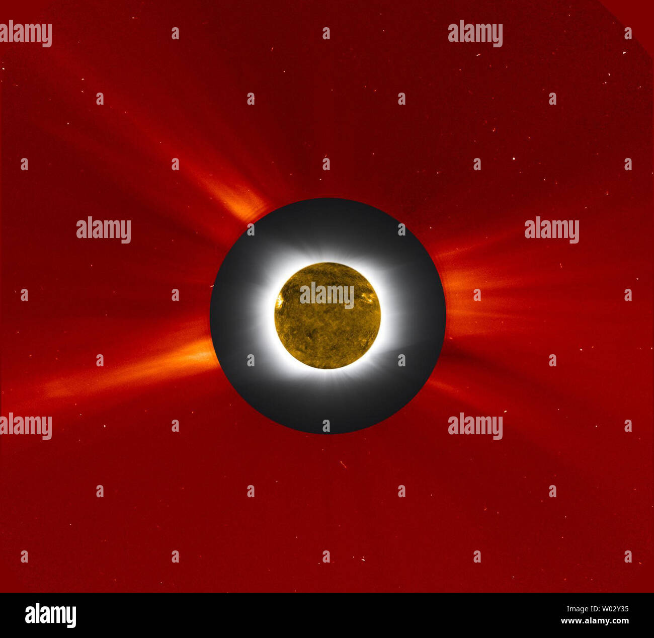 This NASA composite image shows the new moon passed directly in front of the sun, causing a total solar eclipse in the South Pacific, July 11, 2010. In this image, the solar eclipse is shown in gray and white from a photo provided by the Williams College Expedition to Easter Island and was embedded with an image of the sun’s outer corona taken by the Large Angle Spectrometric Coronagraph (LASCO) on the SOHO spacecraft and shown in red false color. LASCO uses a disk to blot out the bright sun and the inner corona so that the faint outer corona can be monitored and studied. Further, the dark sil Stock Photo