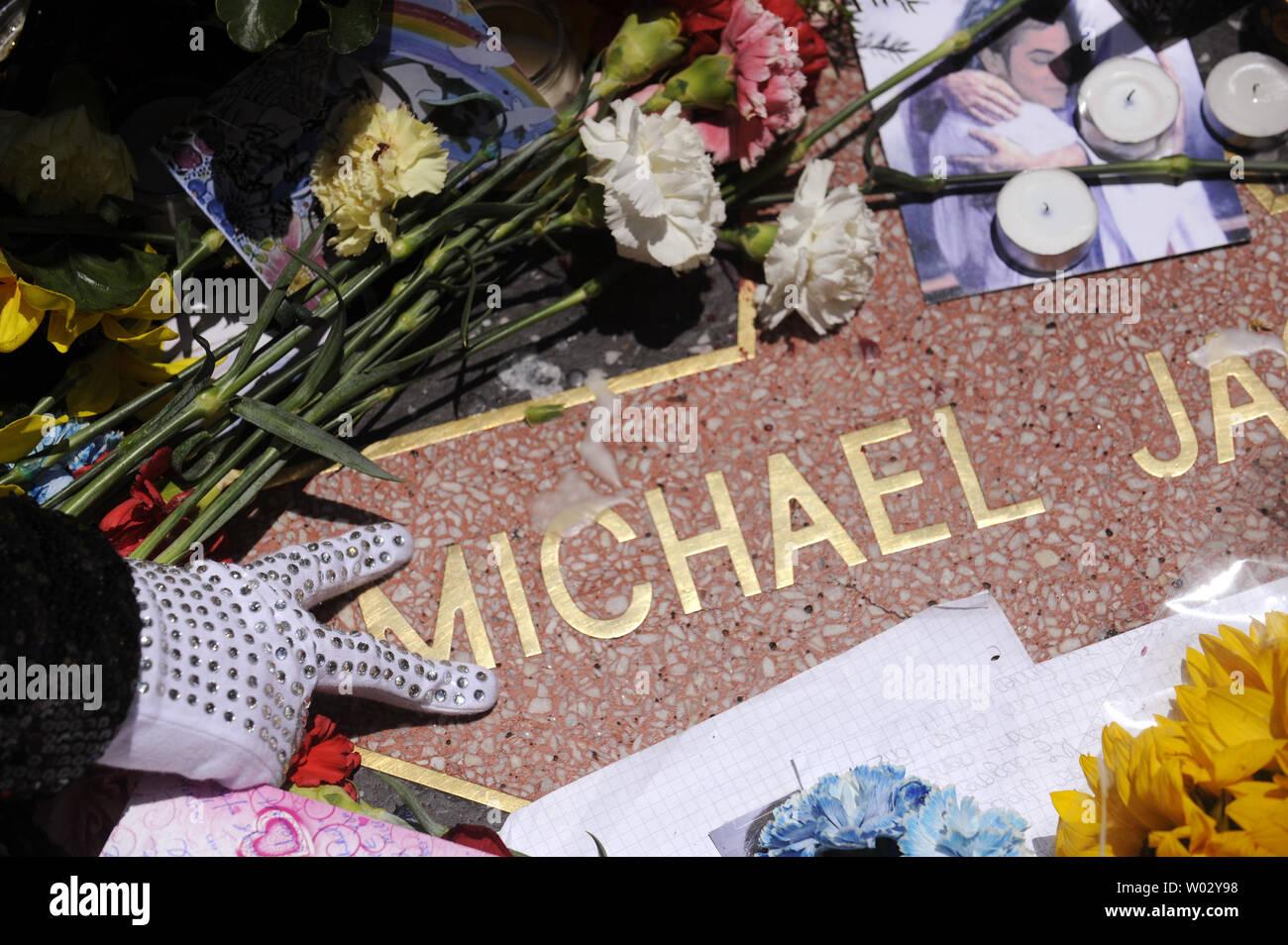 On the one year anniversary of the 'King of Pop's' death, fans visit Michael Jackson's star on the Hollywood Walk of Fame in Los Angeles, California on June 25, 2010.      UPI/ Phil McCarten Stock Photo