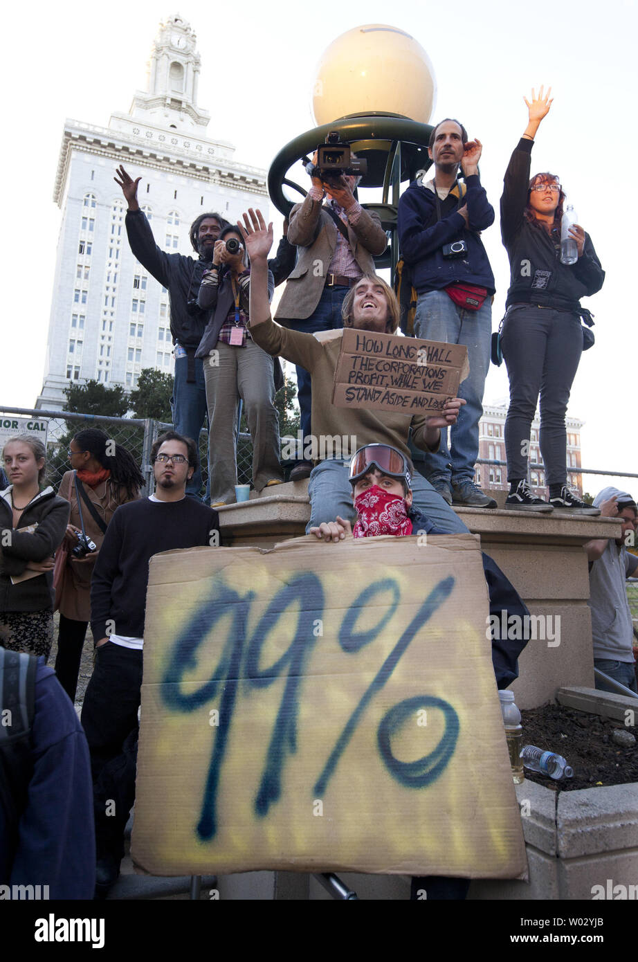 Occupy Oakland protesters listen to speakers in front of Frank H. Ogawa Plaza in Oakland, California on October 26, 2011.  More than a thousand gathered the night after police used tear gas and rubber bullets to disperse the demonstrators.      UPI/Terry Schmitt Stock Photo