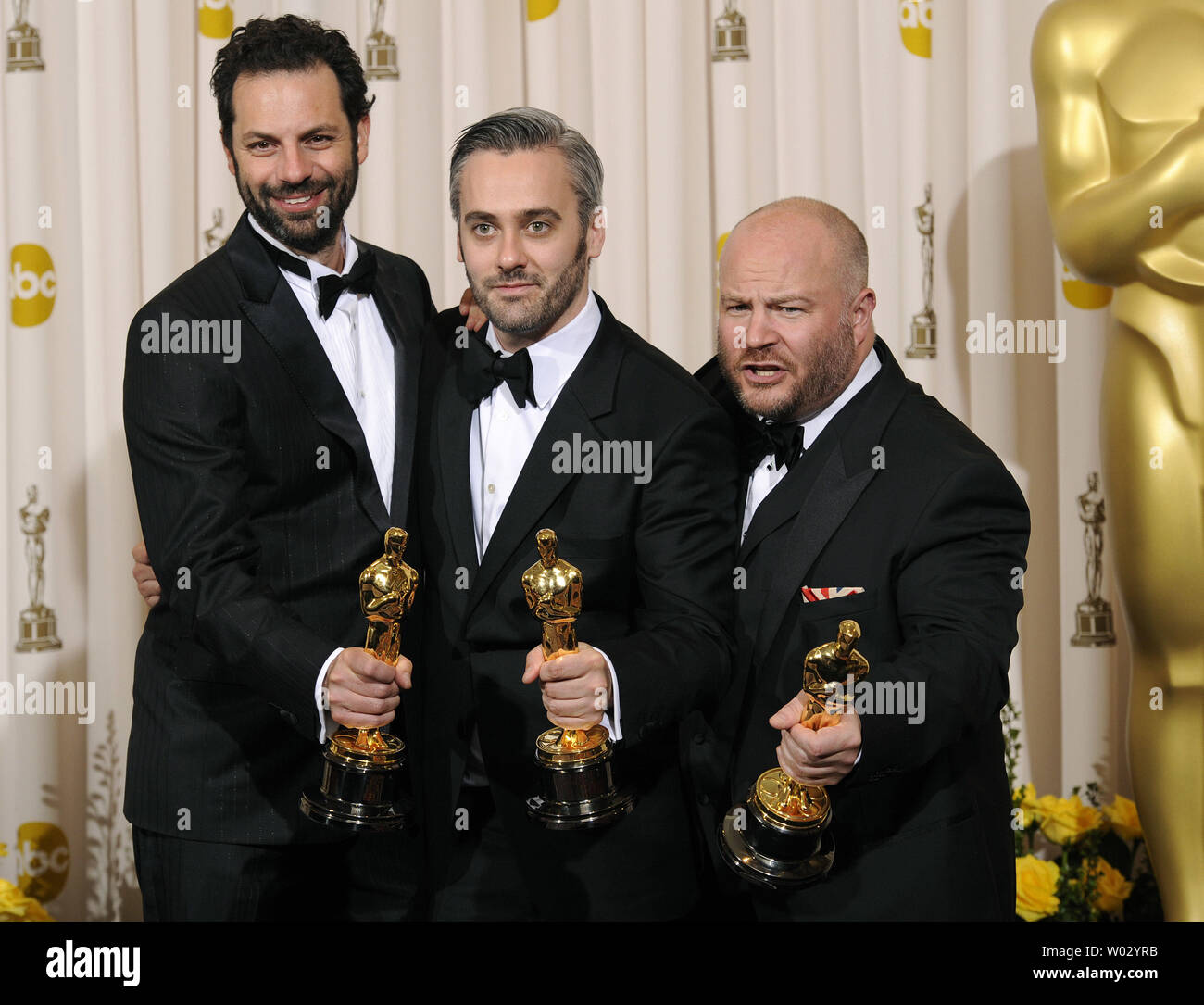 Best Picture winners Iain Canning, Emile Sherman and Gareth Unwin for 'The King's Speech' pose backstage at the 83rd annual Academy Awards in Hollywood on February 27, 2011. UPI/Phil McCarten Stock Photo
