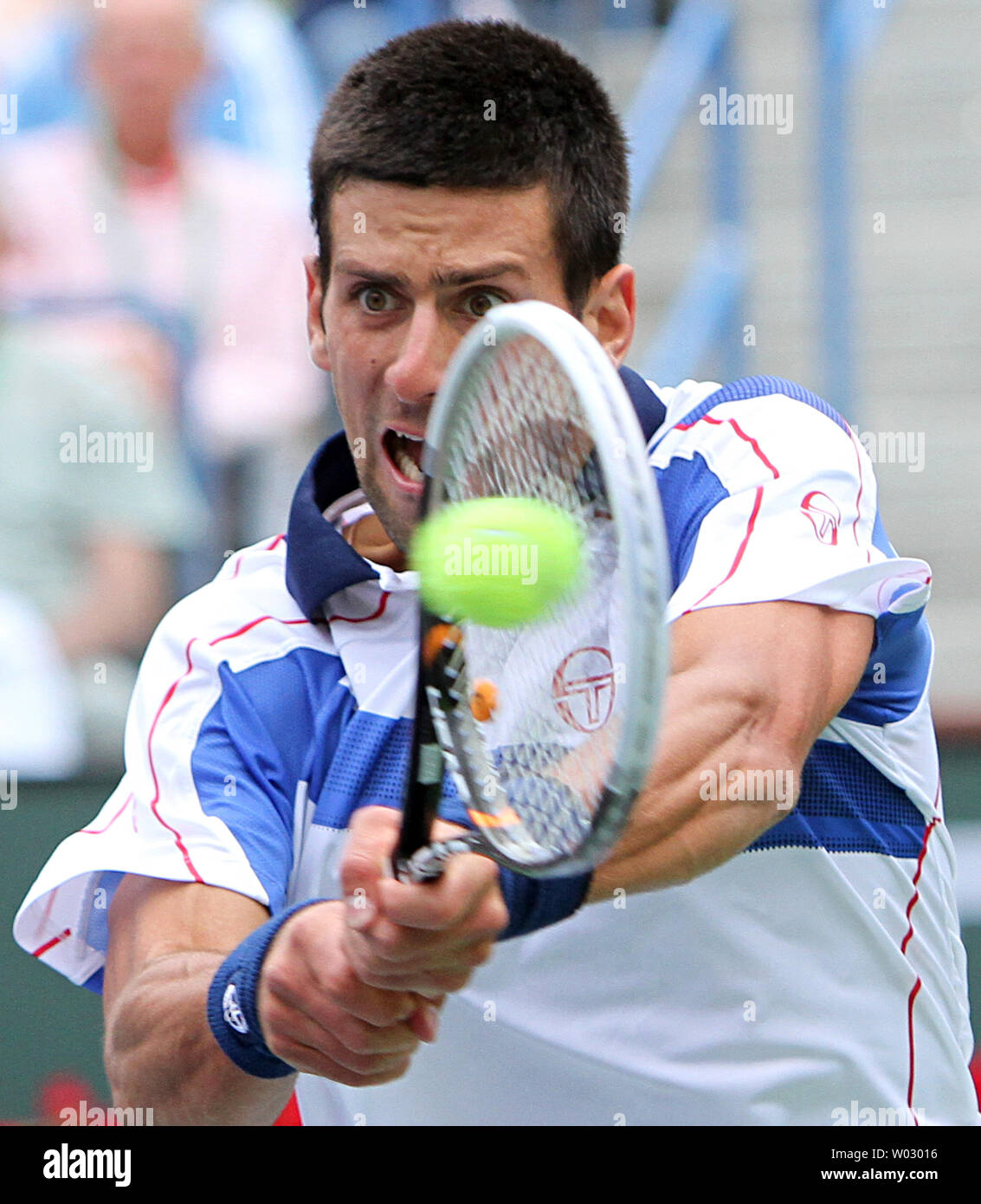 Serbian Novak Djokovic hits a shot during his mens final match against Spaniard Rafael Nadal at the BNP Paribas Open in Indian Wells, California on March 20, 2011.  Djokovic defeated Nadal 4-6, 6-3, 6-2 to win the tournament.   UPI/David Silpa Stock Photo