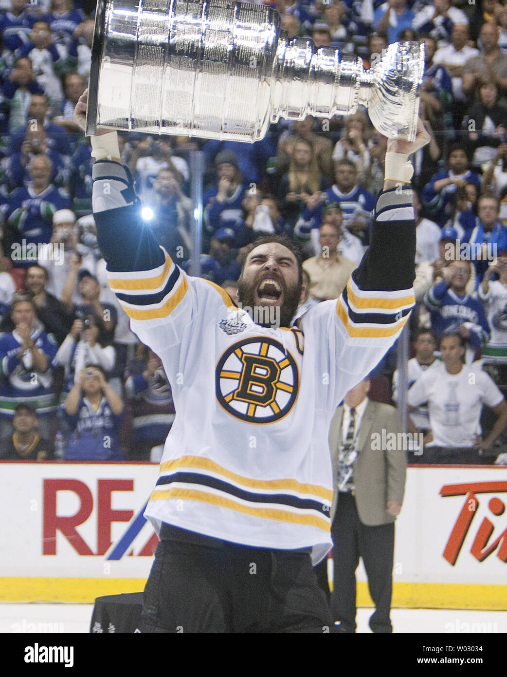 Boston Bruins captain, Zdeno Chara, hoists the Stanley Cup for the