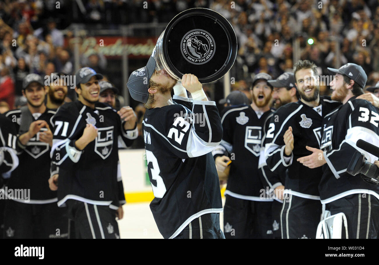 Los Angeles Kings right wing Dustin Brown (23) celebrates with the Cup at  the end of game 6 of the NHL Stanley Cup Finals against the New Jersey  Devils at the Staples