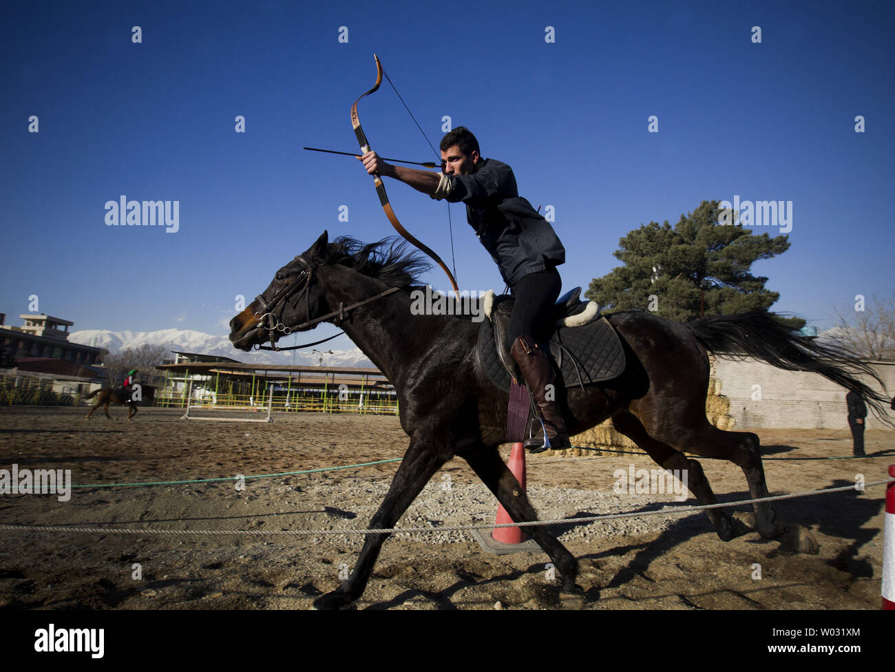 Iranian horseback archer Ghodrat Geravand attends a training session at