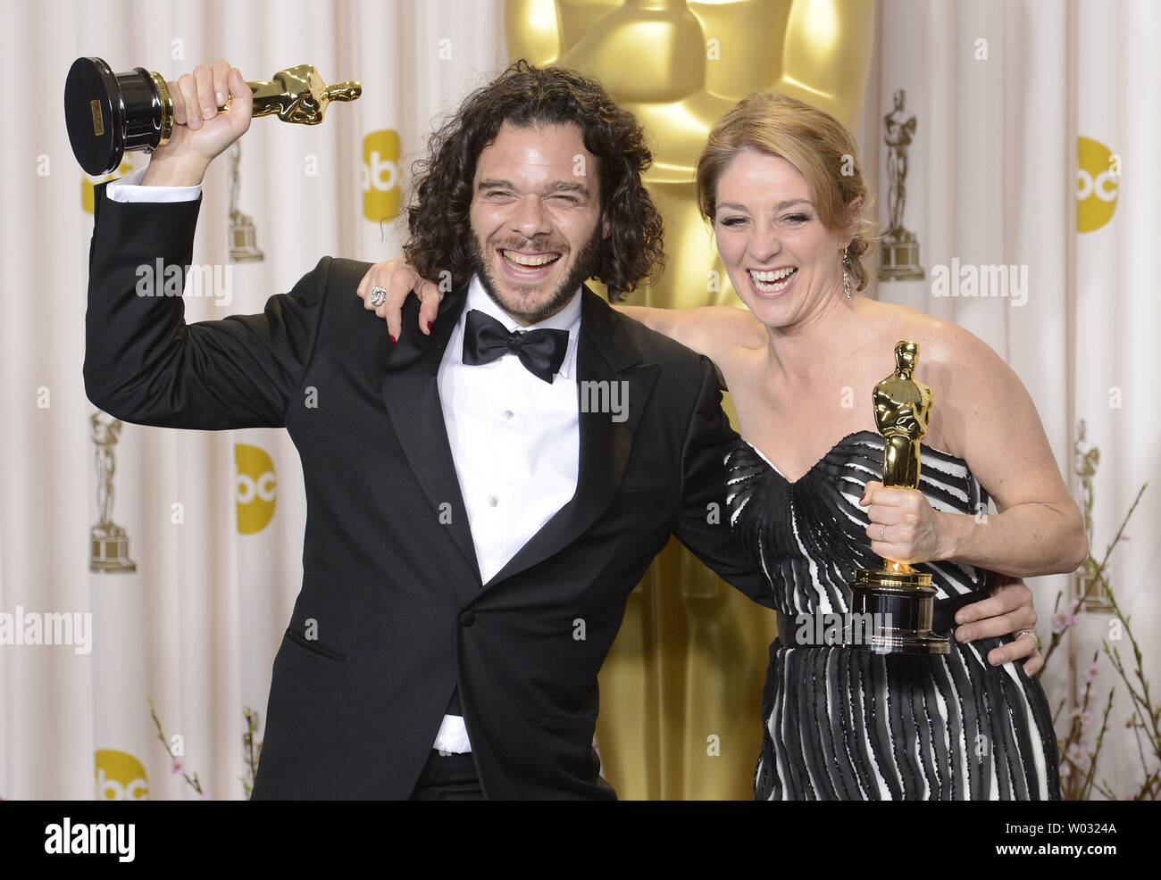 Sean Fine and Andrea Nix Fine pose with their Oscars for Best Documentary Short Subject for 'Inocente' backstage at the 85th Academy Awards at the Hollywood and Highlands Center in the Hollywood section of Los Angeles on February 24, 2013. UPI/Phil McCarten Stock Photo