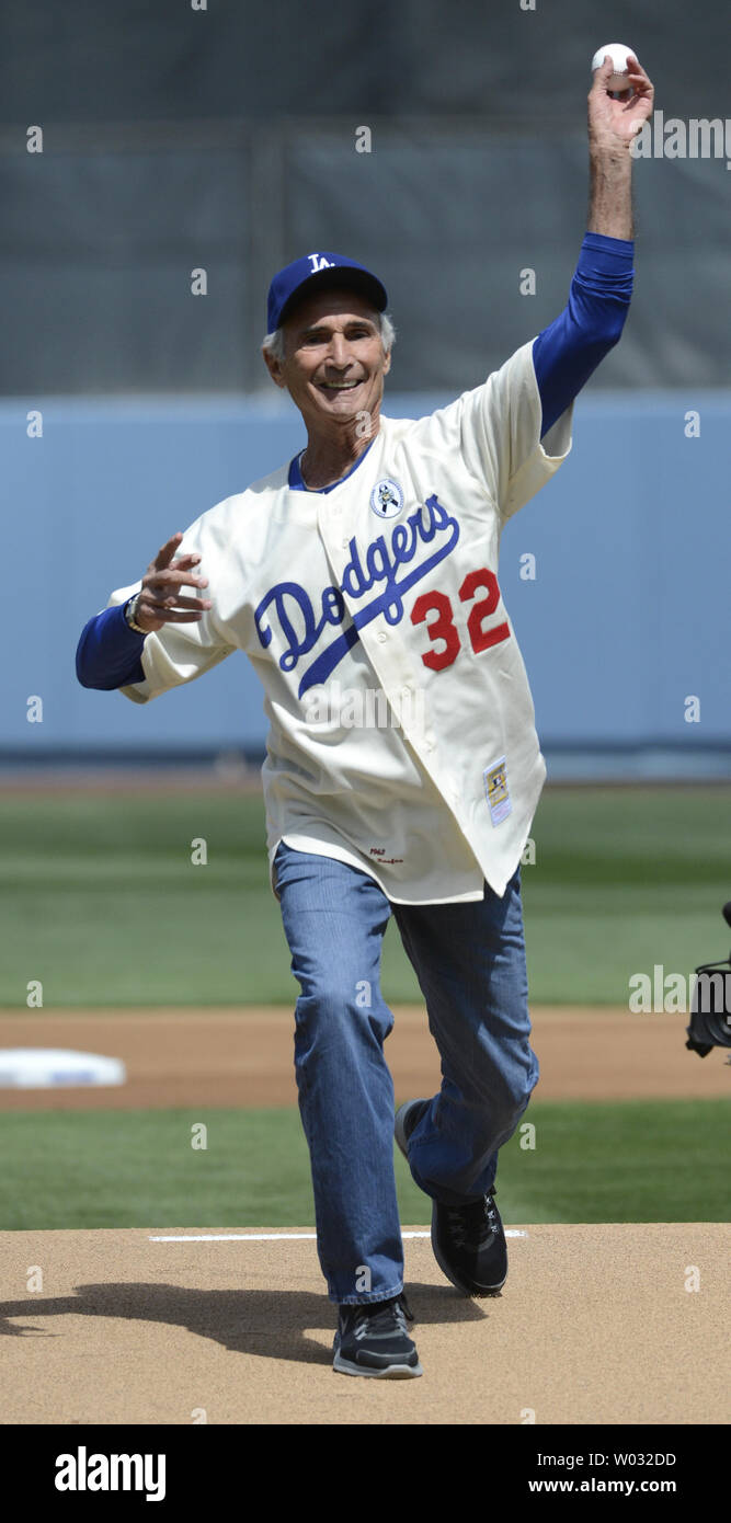 Former Dodger Sandy Koufax throws out the first pitch before the Los Angeles Dodgers play the San Francisco Giants on opening day at Dodger Stadium in Los Angeles on April 1, 2013.        UPI Photo/ Phil McCarten Stock Photo