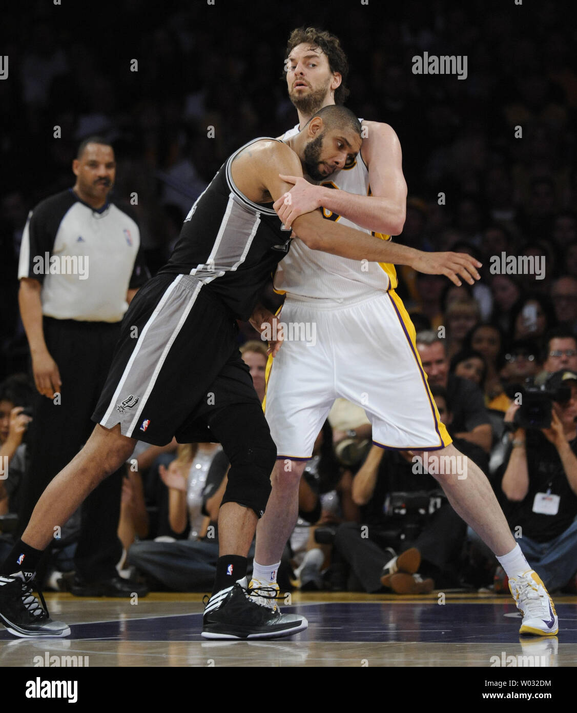 Los Angeles Lakers forward Pau Gasol (16) and San Antonio Spurs power forward Tim Duncan (21) battle for position the first half of Game 4 the Western Conference Playoffs