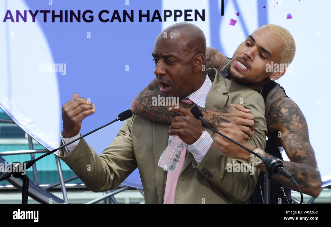 Recording artist Chris Brown embraces Stephen G. Hill, BET's President of Music Programming and Specials, following a BET Awards news conference at Icon Ultra Lounge in Los Angeles on May 14, 2013.  UPI/Jim Ruymen Stock Photo