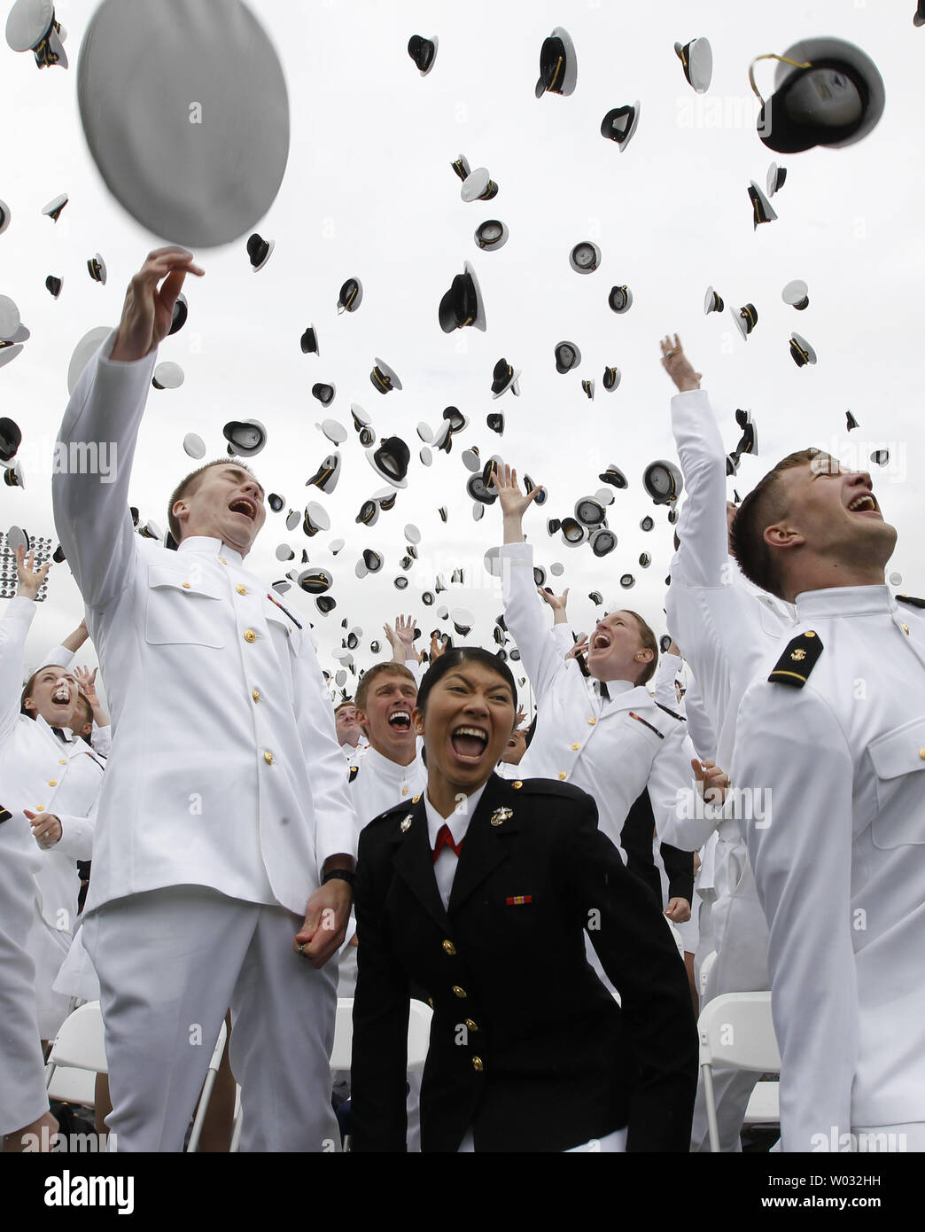 Midshipmen celebrate at the end of the U.S. Naval Academy Graduation