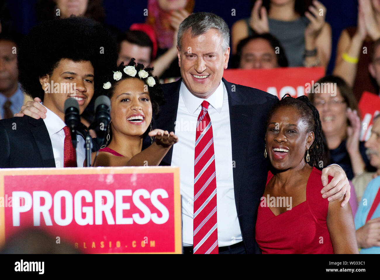 Democratic candidate Bill de Blasio embraces his children Dante and Chiara and wife Chirlane (R) after winning the mayoral election at the Park Slope Armory campaign headquarters in New York on November 5, 2013. De Blasio ran against Republican Joseph Lhota and becomes the first new mayor in twelve years, replacing Michael Bloomberg.     UPI/Monika Graff Stock Photo