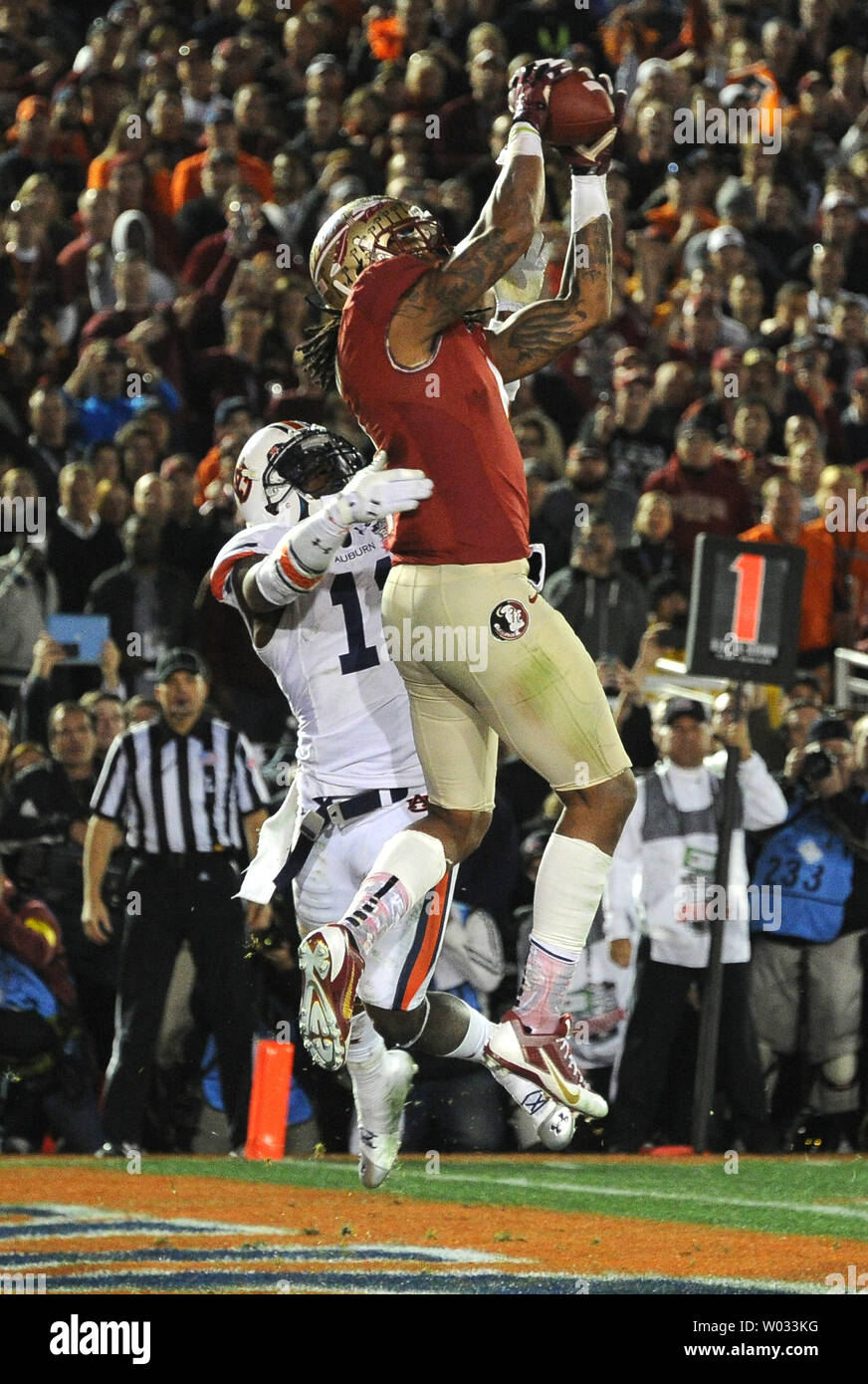 Florida State Seminoles receiver Kelvin Benjamin makes the game-winning touchdown catch over Auburn Tiger cornerback Chris Davis with 13 seconds left in the BCS national title college game at the Rose Bowl in Pasadena, California on January 6, 2014.   Heisman Trophy winner quarterback Jameis Winston threw the two-yard pass.   Florida State defeated Auburn by a score of 34-31.   UPI/Jon SooHoo Stock Photo