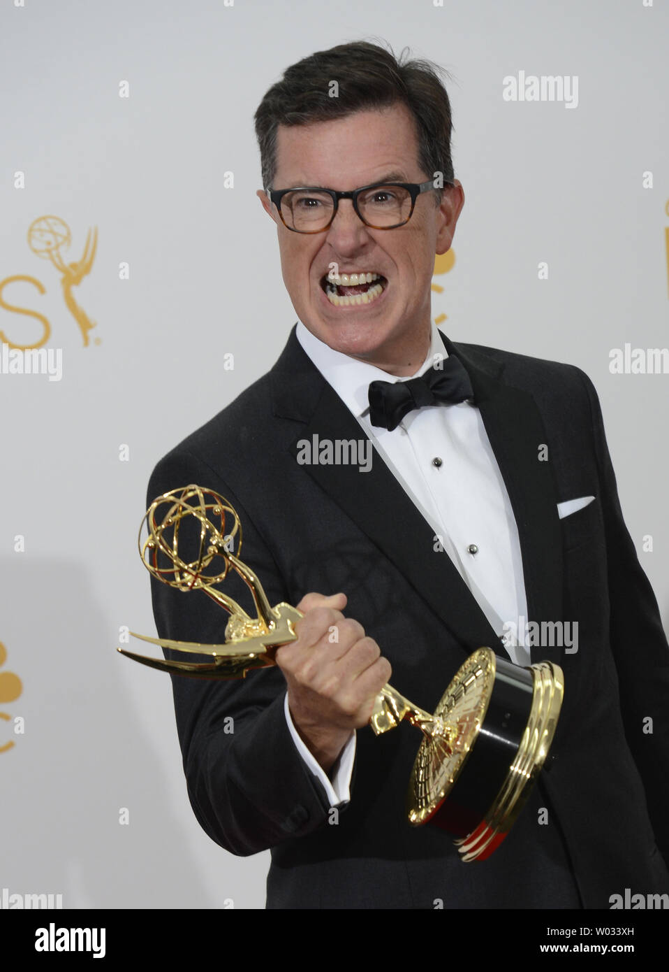 Stephen Colbert holds his Emmy for Outstanding Variety Series for 'The Colbert Report', at the Primetime Emmy Awards at the Nokia Theatre in Los Angeles on August 25, 2014.     UPI/Phil McCarten Stock Photo