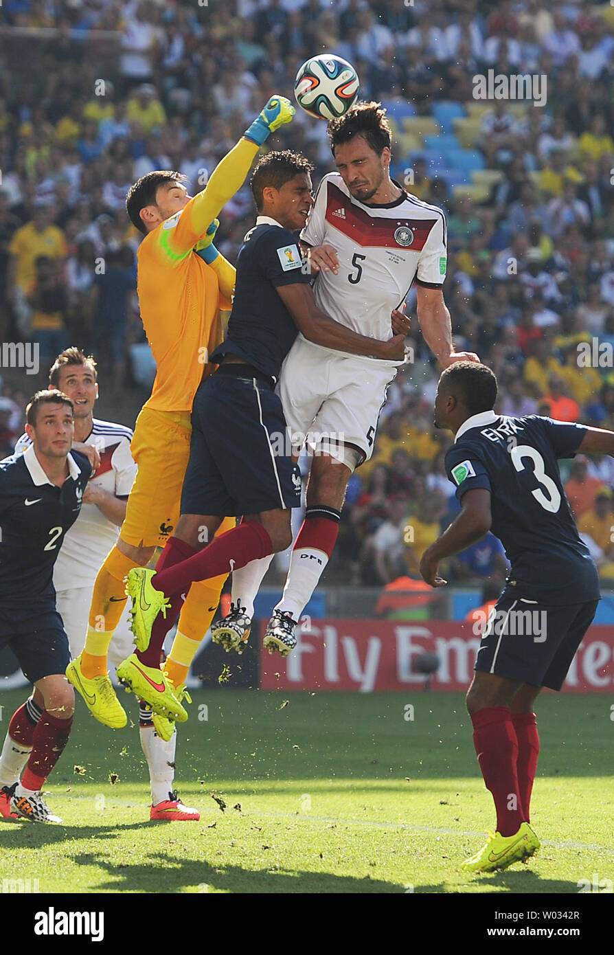 Hugo Lloris of France punches clear under pressure from Mats Hummels of Germany during the 2014 FIFA World Cup Quarter Final match at the Estadio do Maracana in Rio de Janeiro, Brazil on July 04, 2014. UPI/Chris Brunskill Stock Photo