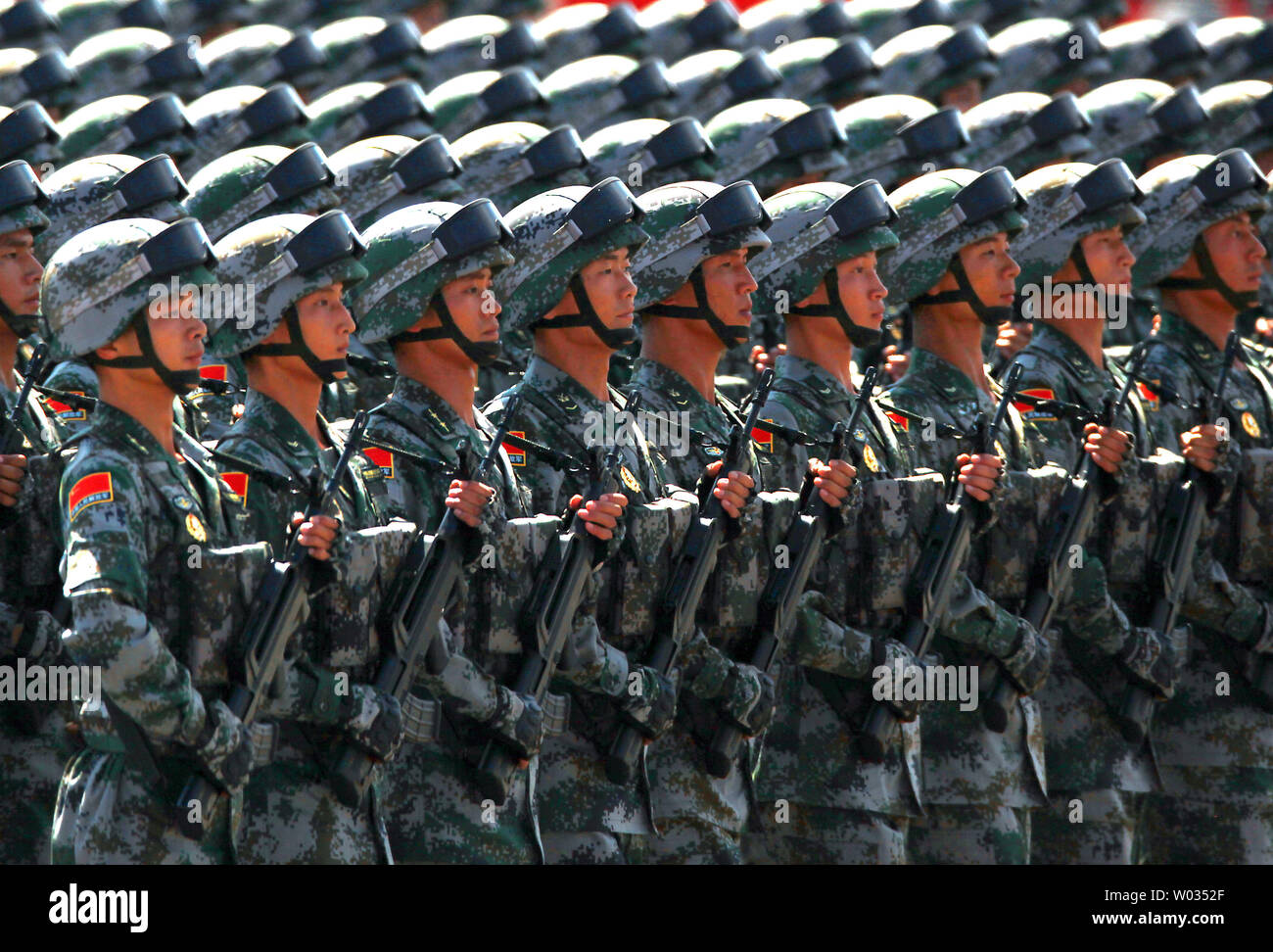 Over 12,000 soldiers and hundreds of tanks, ballistic missile launchers, amphibious assault vehicles, drones, fighter jets, helicopters and other military equipment participate in a massive parade marking the 70th anniversary of victory over Japan and the end of World War II in Beijing on September 3, 2015. Presiding over the extravaganza, President Xi Jinping, China's most powerful leader in decades, said that China would remain committed to 'the path of peaceful development' and unexpectedly vowed to cut 300,000 troops from its 2.3-million strong military -  the world's largest. Photo by Ste Stock Photo